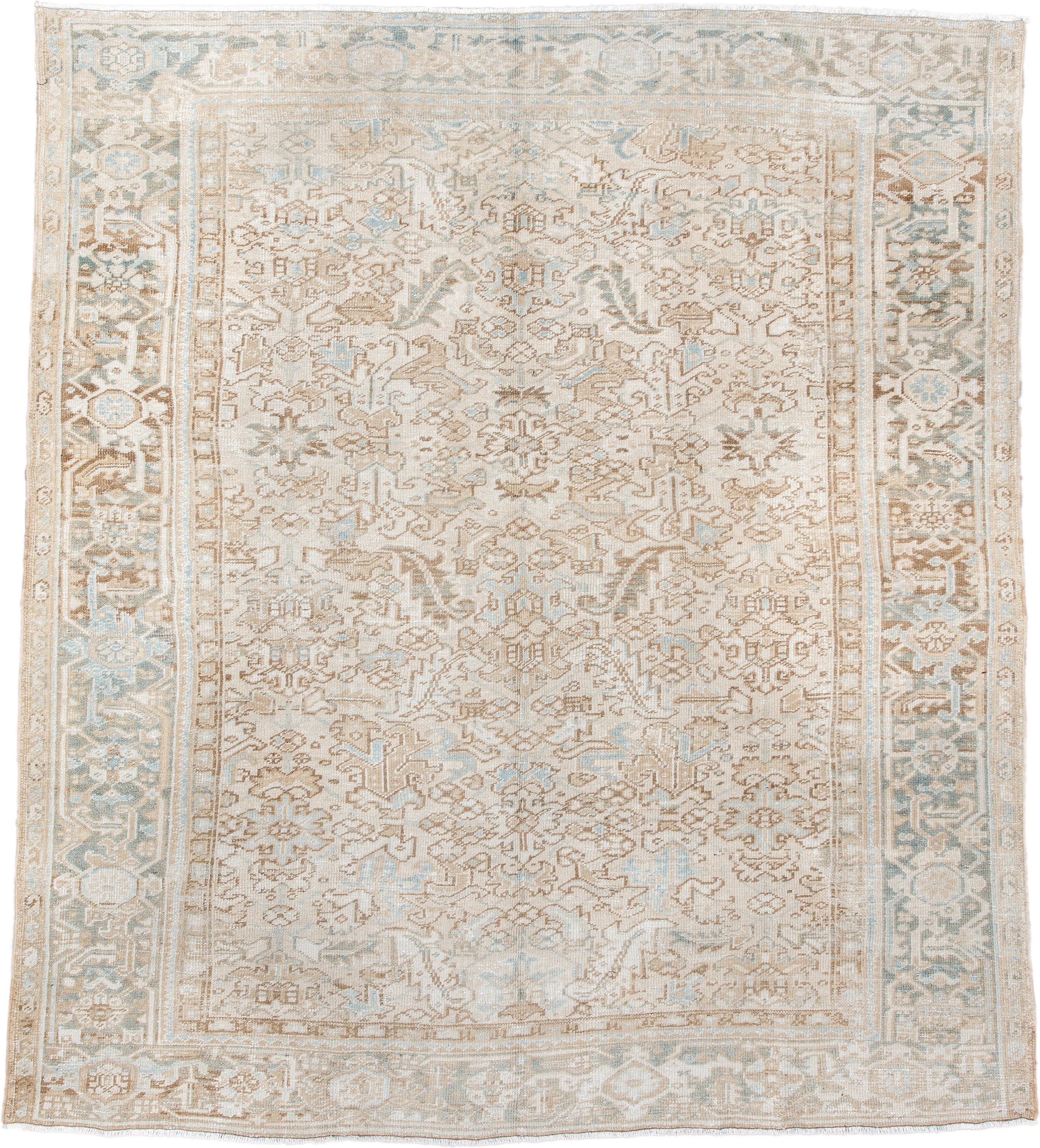 7' x 8' one-of-a-kind handmade antique Heriz rug. Color palette: ivory, taupe, pale blue, sand, beige, camel, gray