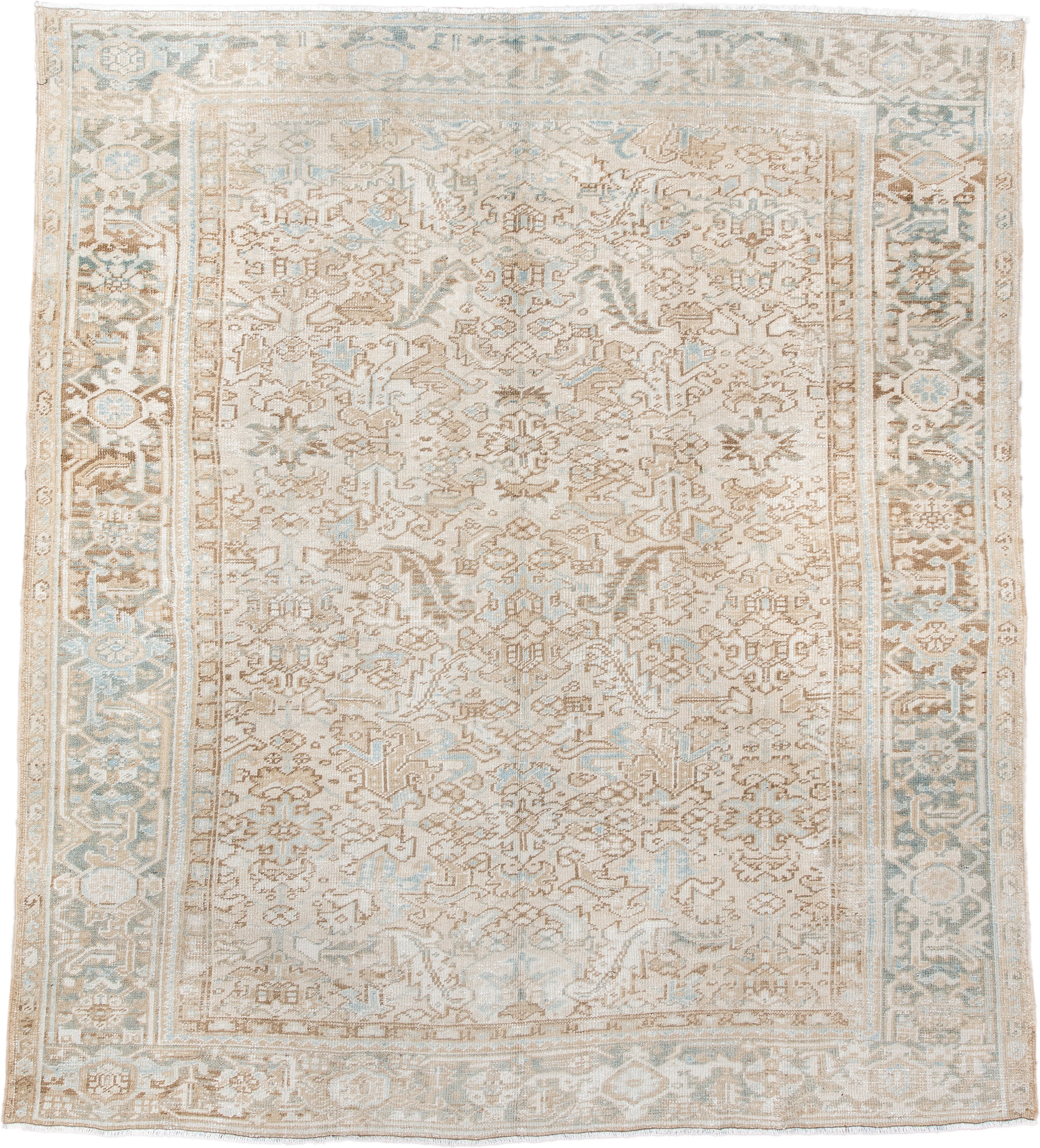 7' x 8' one-of-a-kind handmade antique Heriz rug. Color palette: ivory, taupe, pale blue, sand, beige, camel, gray