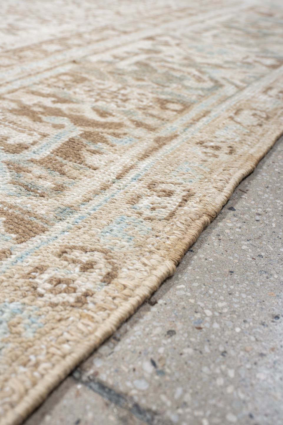 7' x 8' one-of-a-kind handmade antique Heriz rug. Color palette: ivory, taupe, pale blue, sand, beige, camel, gray