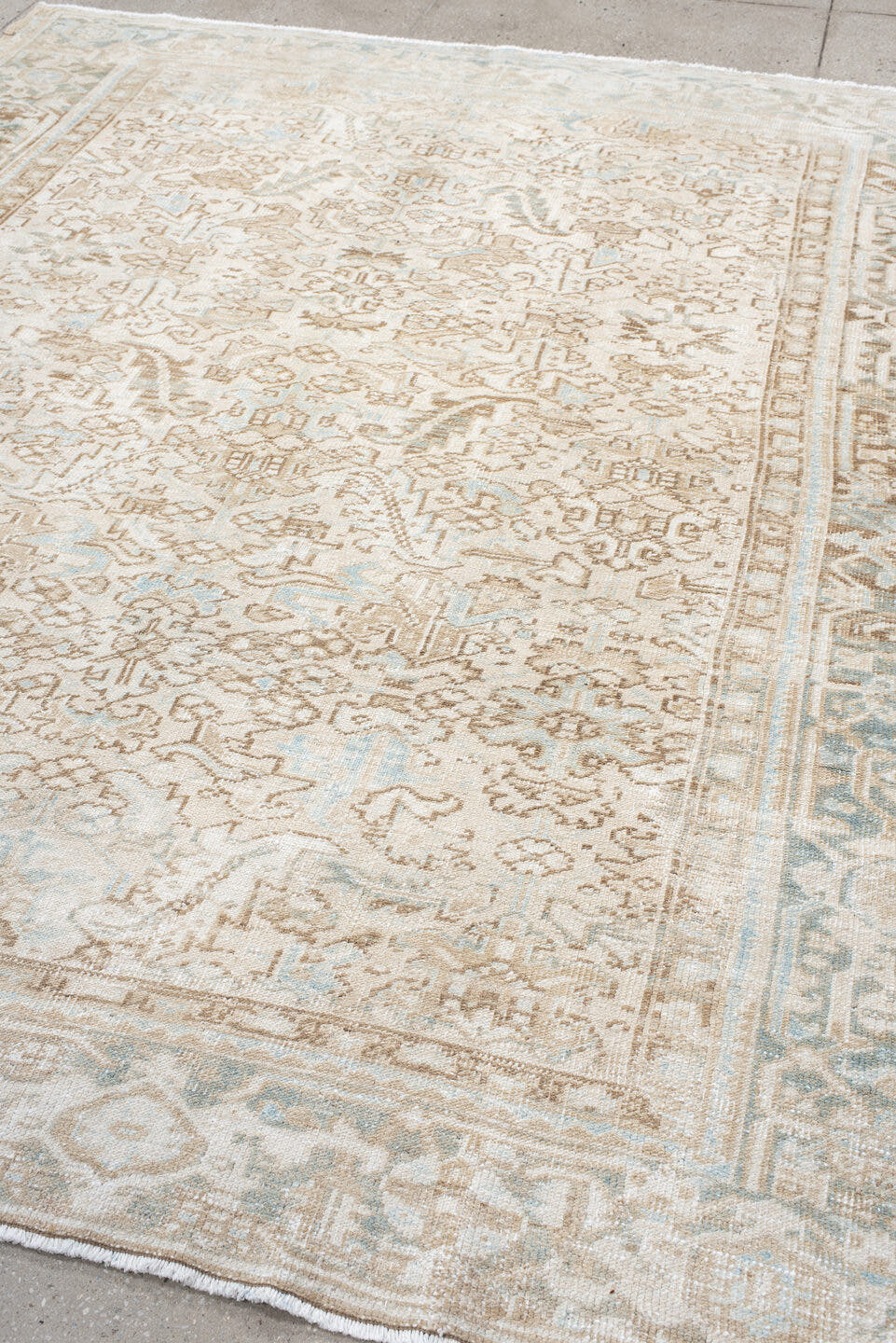 7' x 8' one-of-a-kind handmade antique Heriz rug. Color palette: ivory, taupe, pale blue, sand, beige, camel, gray