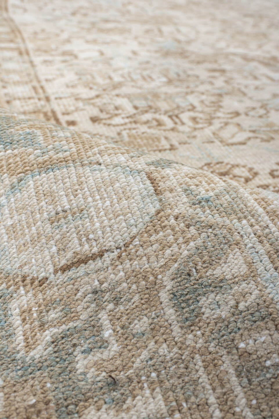 7' x 8' one-of-a-kind handmade antique Heriz rug. Color palette: ivory, taupe, pale blue, sand, beige, camel, gray
