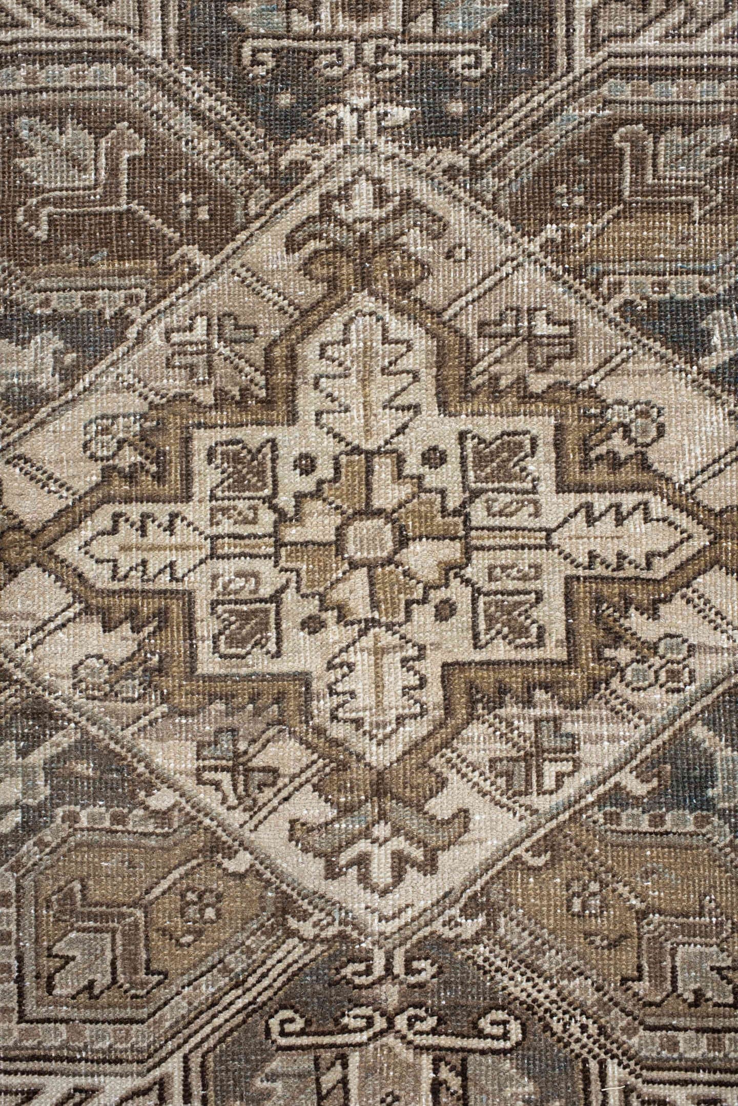 6' x 9' one-of-a-kind handmade antique Heriz rug. Color palette: ivory, taupe, camel, charcoal, brown, sage, beige, gray
