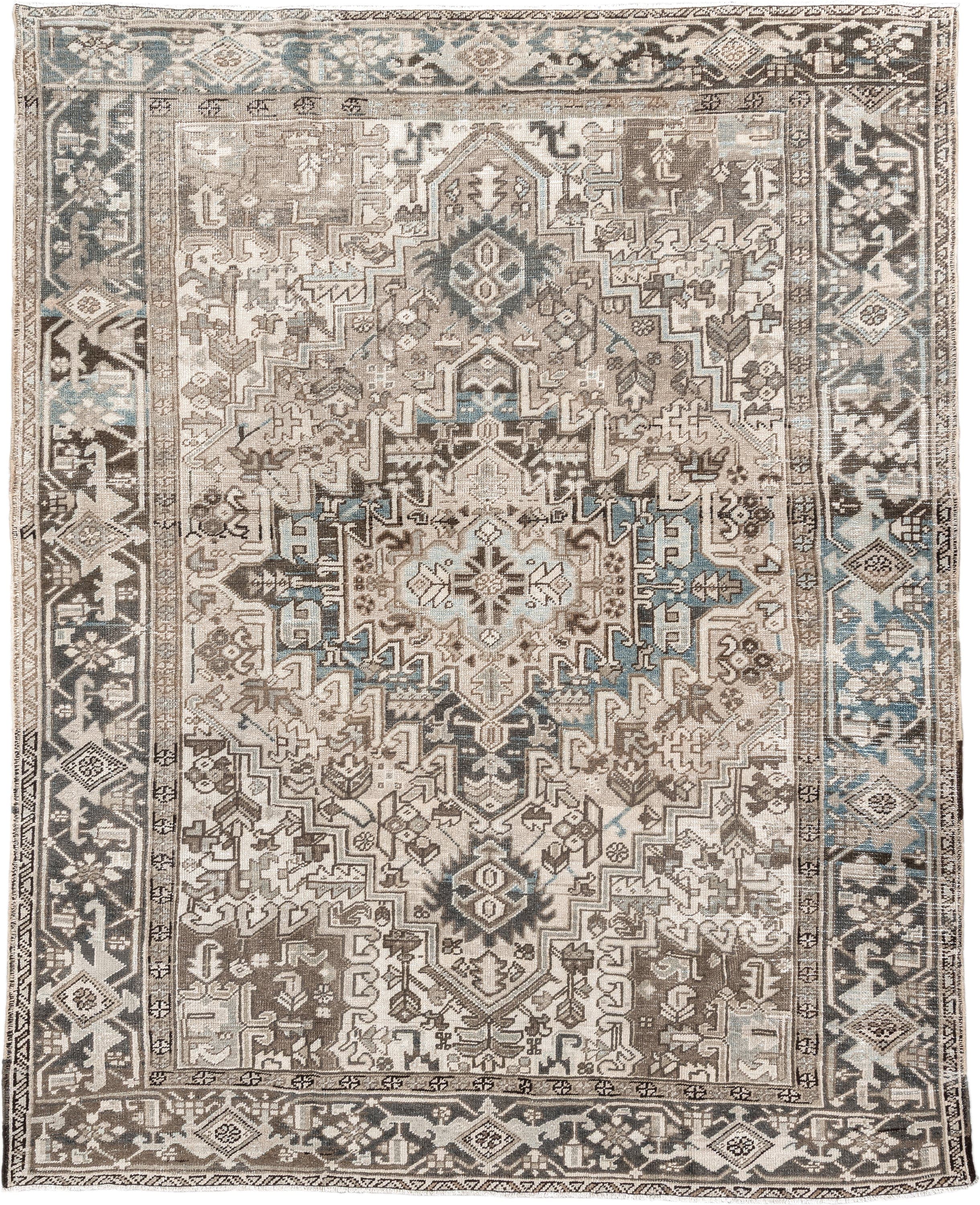 7' x 9' one-of-a-kind handmade antique Heriz rug. Color palette: ivory, taupe, charcoal, beige, sky blue, brown, gray, black