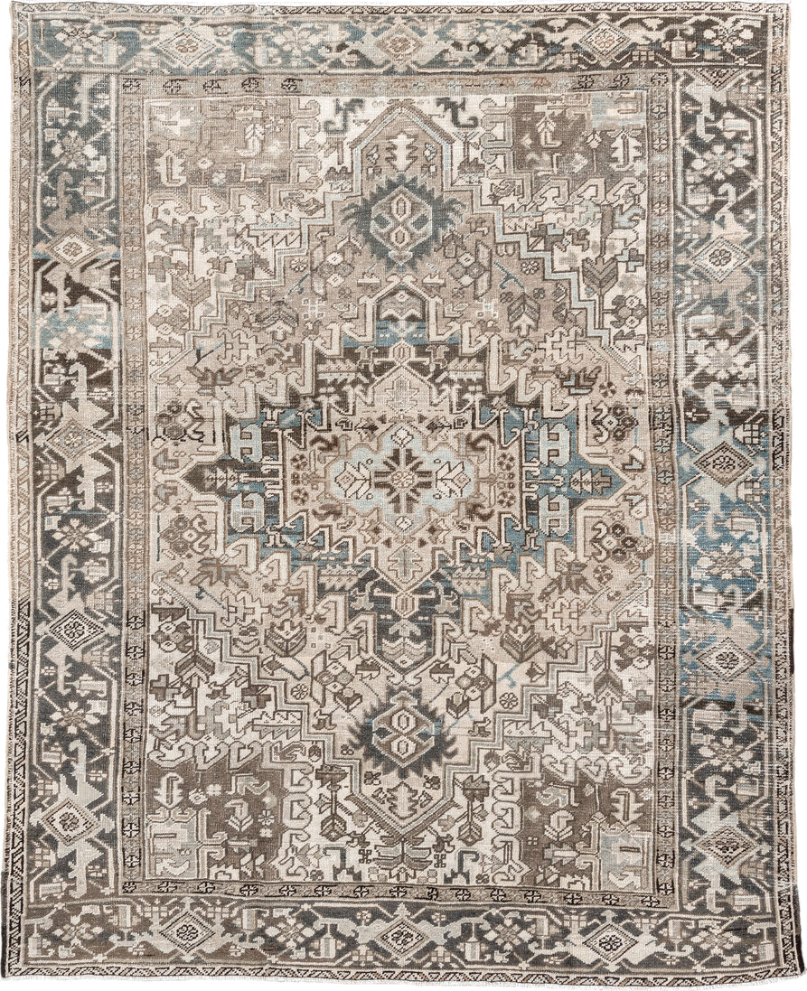 7' x 9' one-of-a-kind handmade antique Heriz rug. Color palette: ivory, taupe, charcoal, beige, sky blue, brown, gray, black