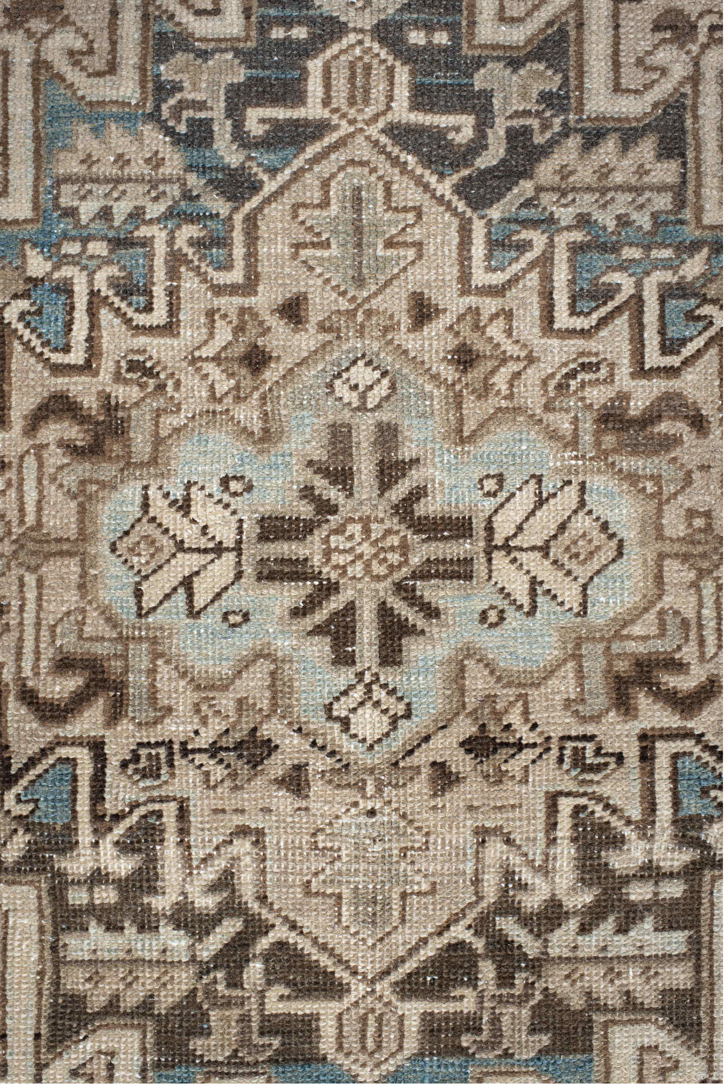 7' x 9' one-of-a-kind handmade antique Heriz rug. Color palette: ivory, taupe, charcoal, beige, sky blue, brown, gray, black