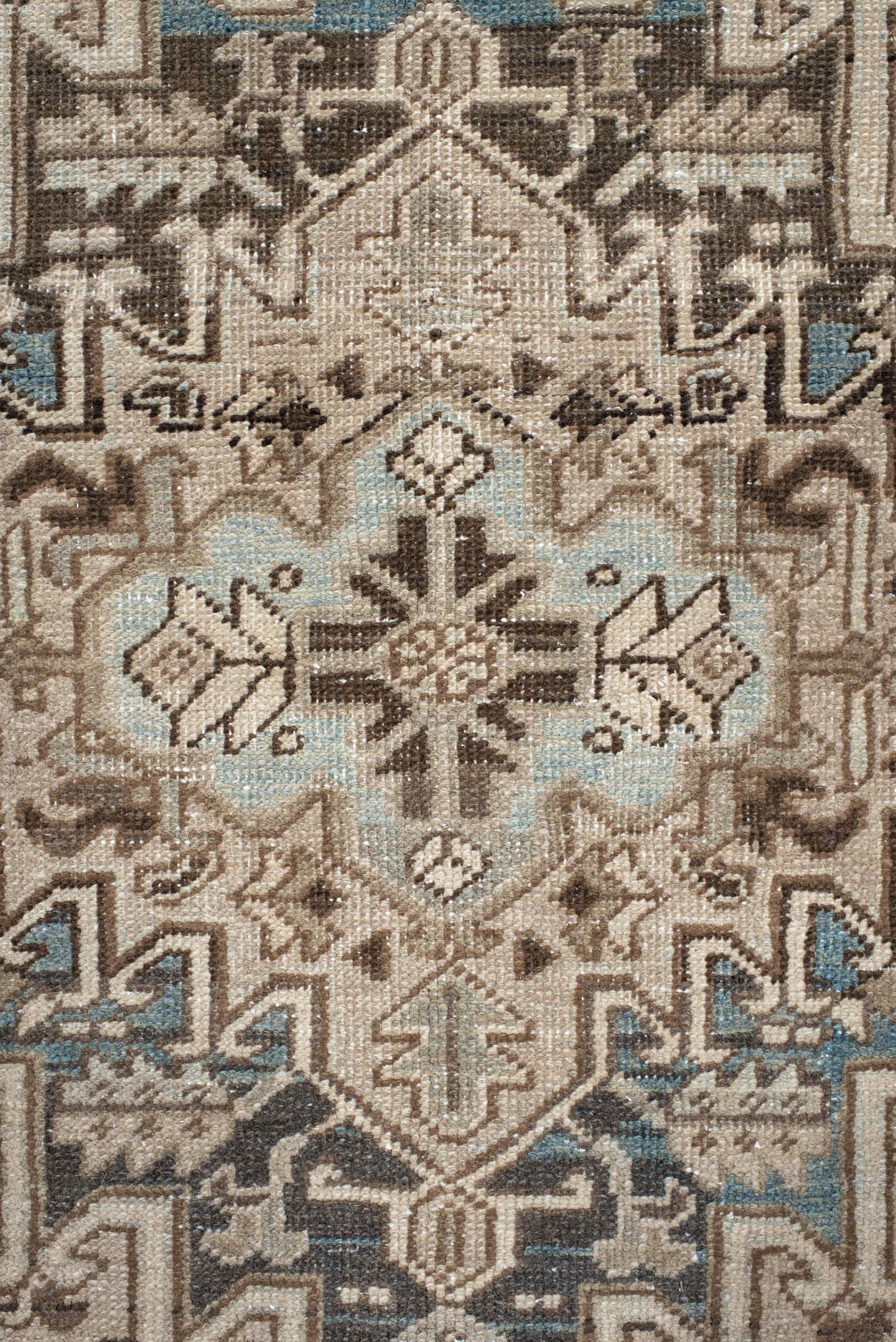 7' x 9' one-of-a-kind handmade antique Heriz rug. Color palette: ivory, taupe, charcoal, beige, sky blue, brown, gray, black