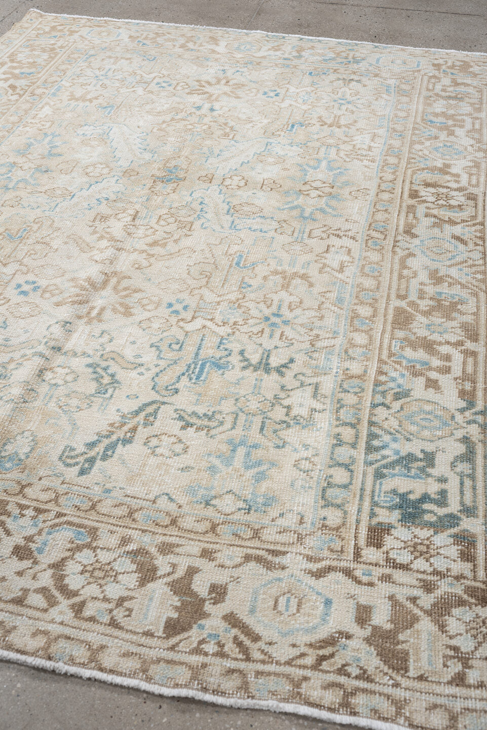 6' x 7' one-of-a-kind handmade vintage Heriz medium size rug. Color palette: ivory, taupe, sky blue, beige, camel