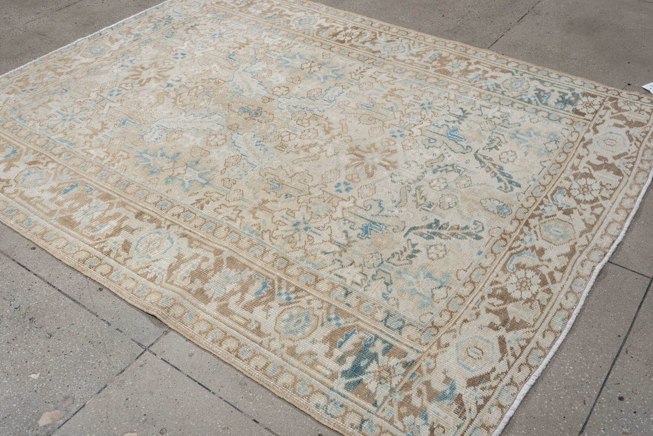 6' x 7' one-of-a-kind handmade vintage Heriz medium size rug. Color palette: ivory, taupe, sky blue, beige, camel