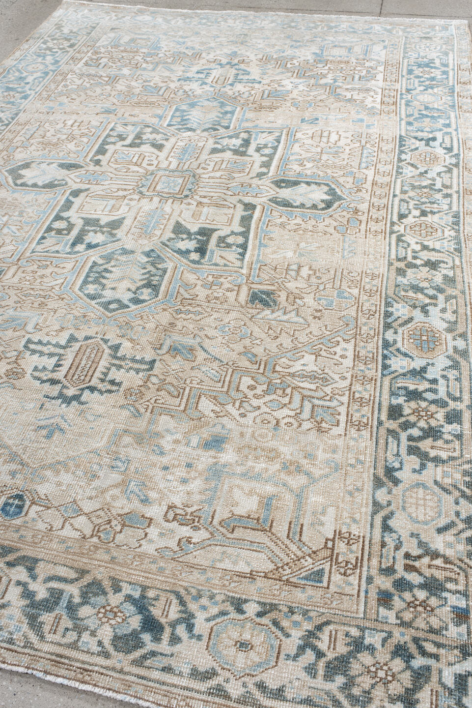 6' x 10' one-of-a-kind handmade antique Heriz large size rug. Color palette: ivory, sky blue, taupe, charcoal, beige, slate