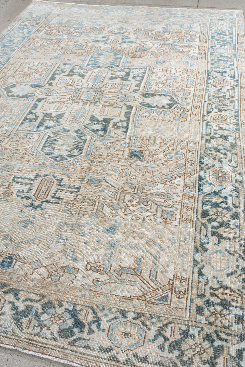 6' x 10' one-of-a-kind handmade antique Heriz large size rug. Color palette: ivory, sky blue, taupe, charcoal, beige, slate