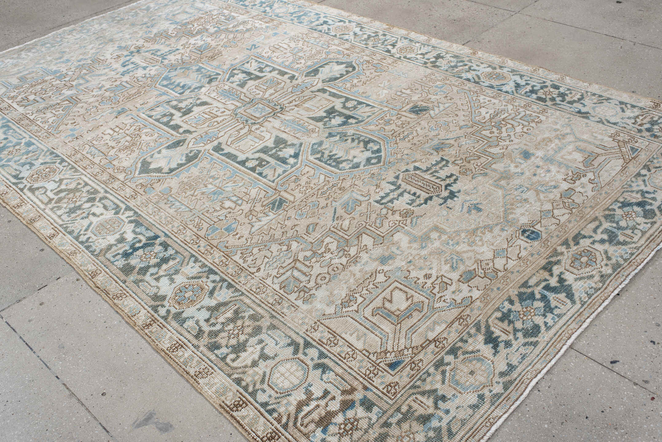 6' x 10' one-of-a-kind handmade antique Heriz large size rug. Color palette: ivory, sky blue, taupe, charcoal, beige, slate