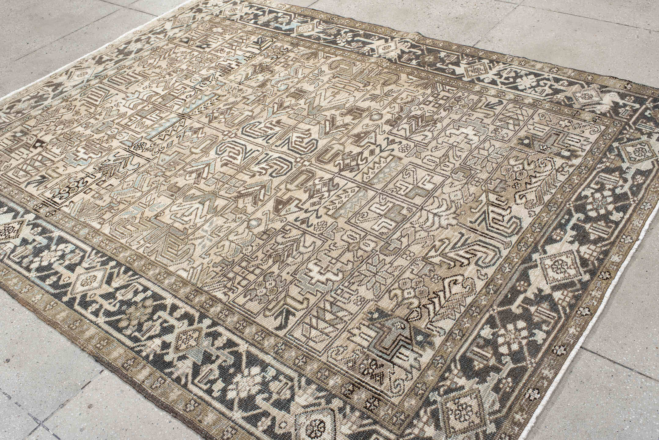 6' x 8' one-of-a-kind handmade antique Heriz medium size rug. Color palette: ivory, taupe, brown, charcoal, camel, slate