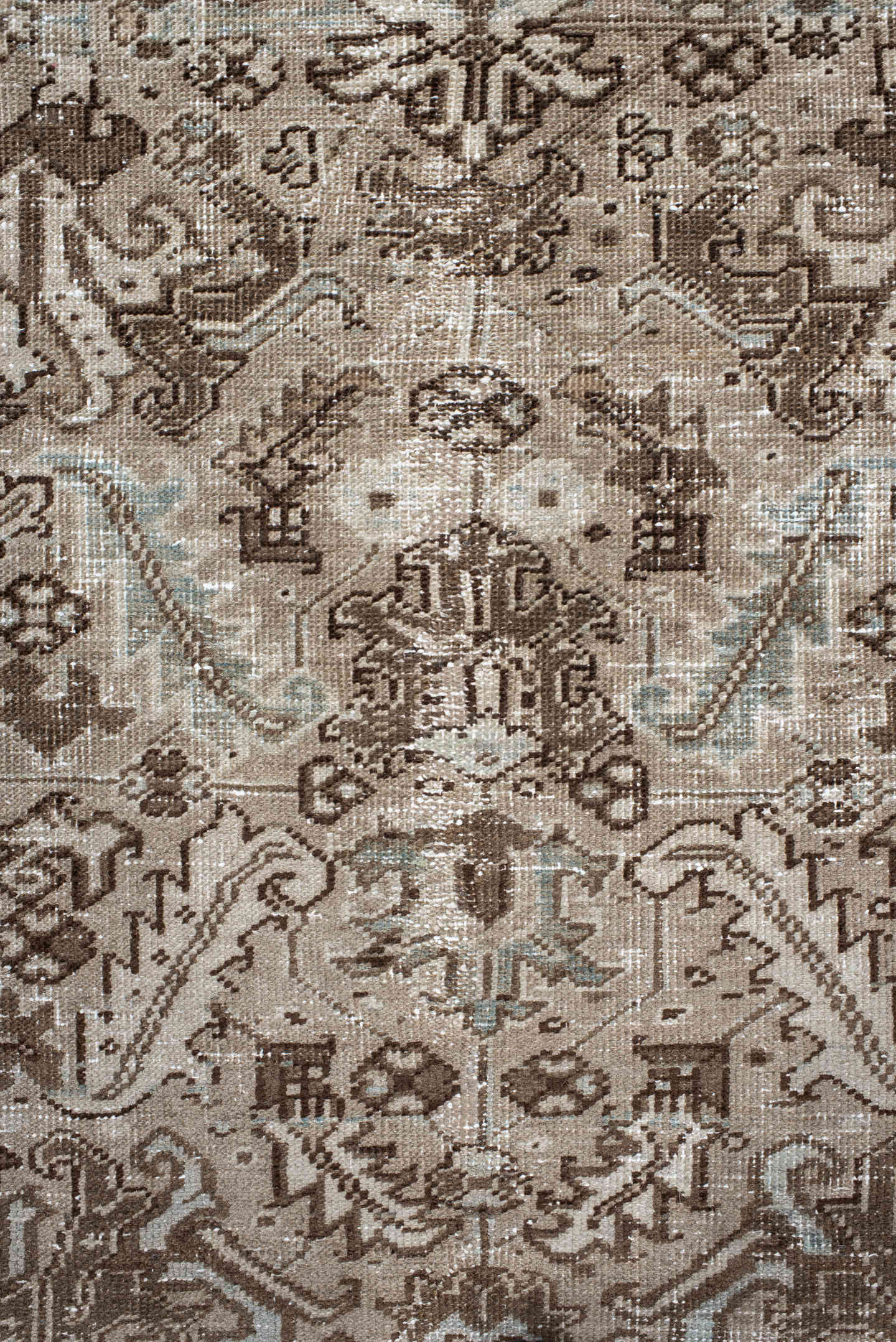 7' x 9' one-of-a-kind handmade antique Heriz rug. Color palette: taupe, brown, ivory, beige, pale blue, camel, gray