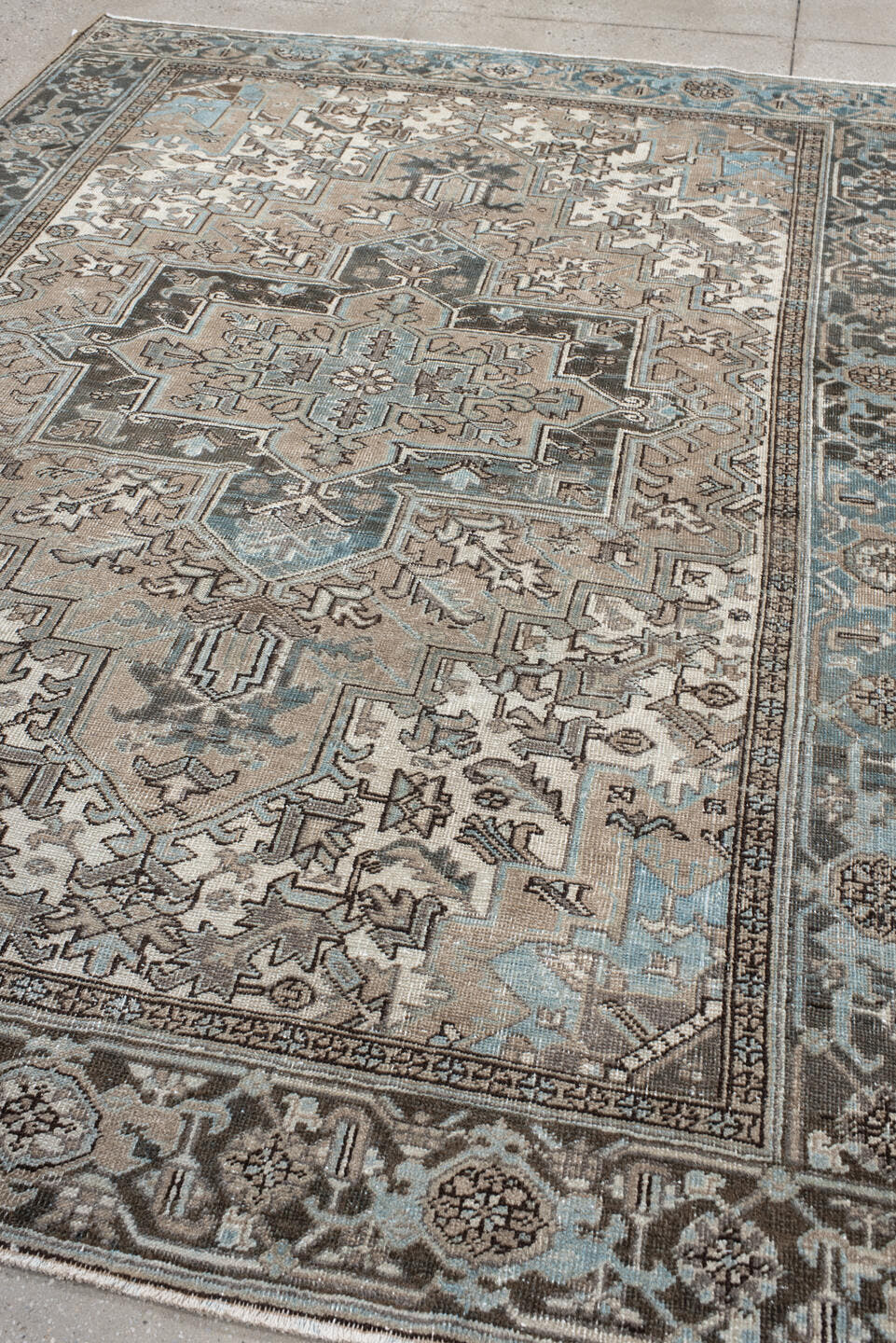 6' x 9' one-of-a-kind handmade antique Heriz medium size rug. Color palette: taupe, sky blue, charcoal, ivory, slate, brown