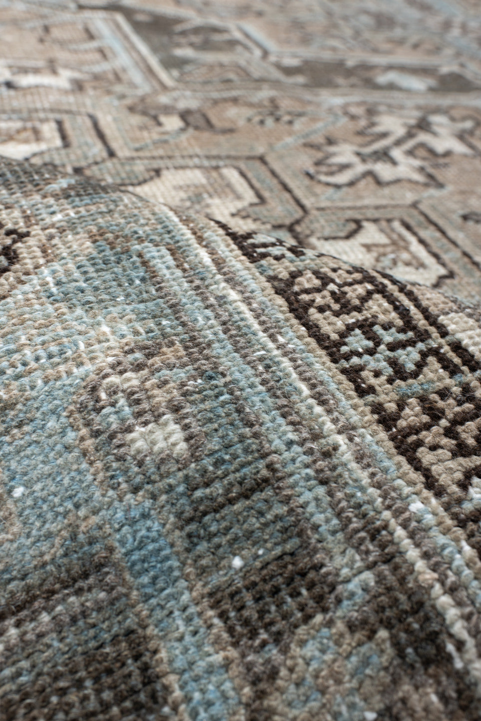 6' x 9' one-of-a-kind handmade antique Heriz medium size rug. Color palette: taupe, sky blue, charcoal, ivory, slate, brown