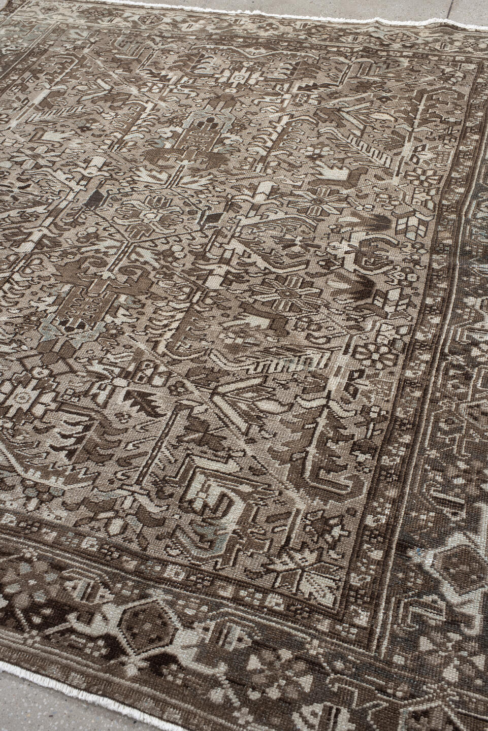 7' x 7' one-of-a-kind handmade antique Heriz rug. Color palette: taupe, brown, ivory, gray, charcoal, beige, black