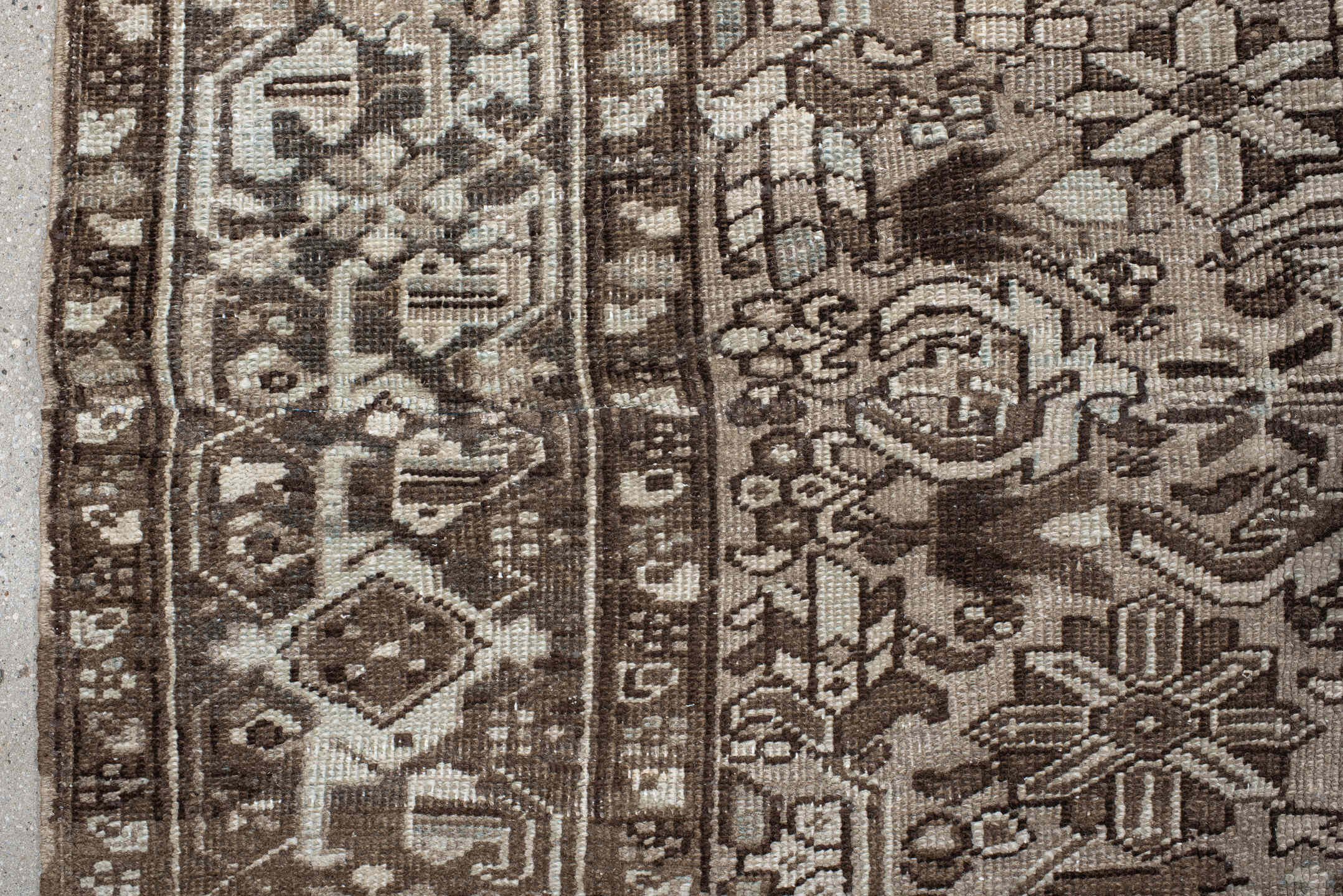 7' x 7' one-of-a-kind handmade antique Heriz rug. Color palette: taupe, brown, ivory, gray, charcoal, beige, black