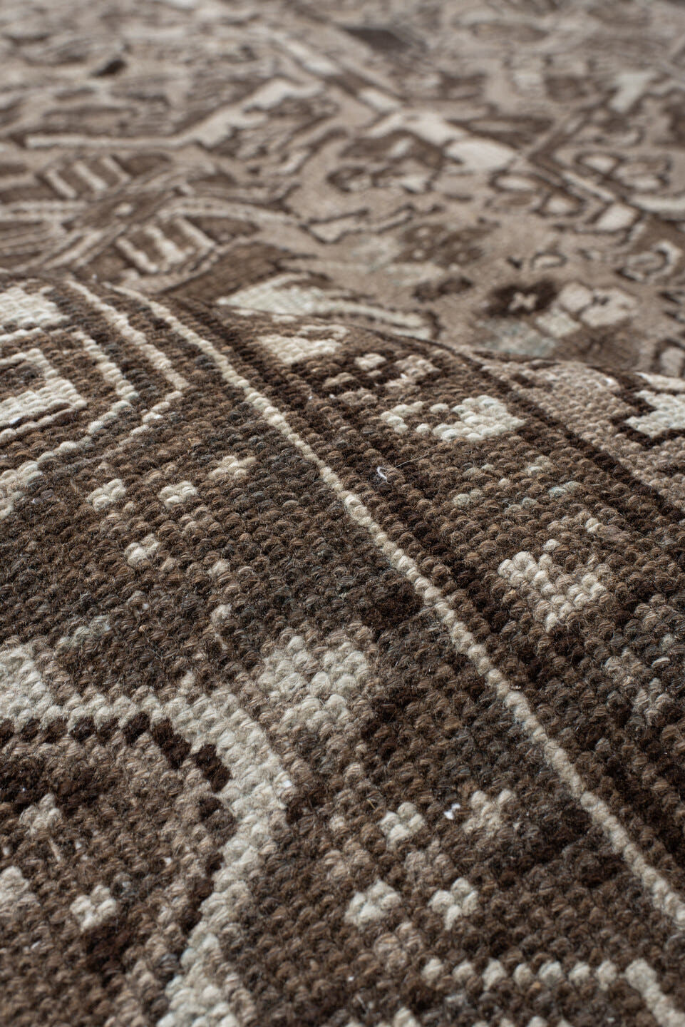 7' x 7' one-of-a-kind handmade antique Heriz rug. Color palette: taupe, brown, ivory, gray, charcoal, beige, black