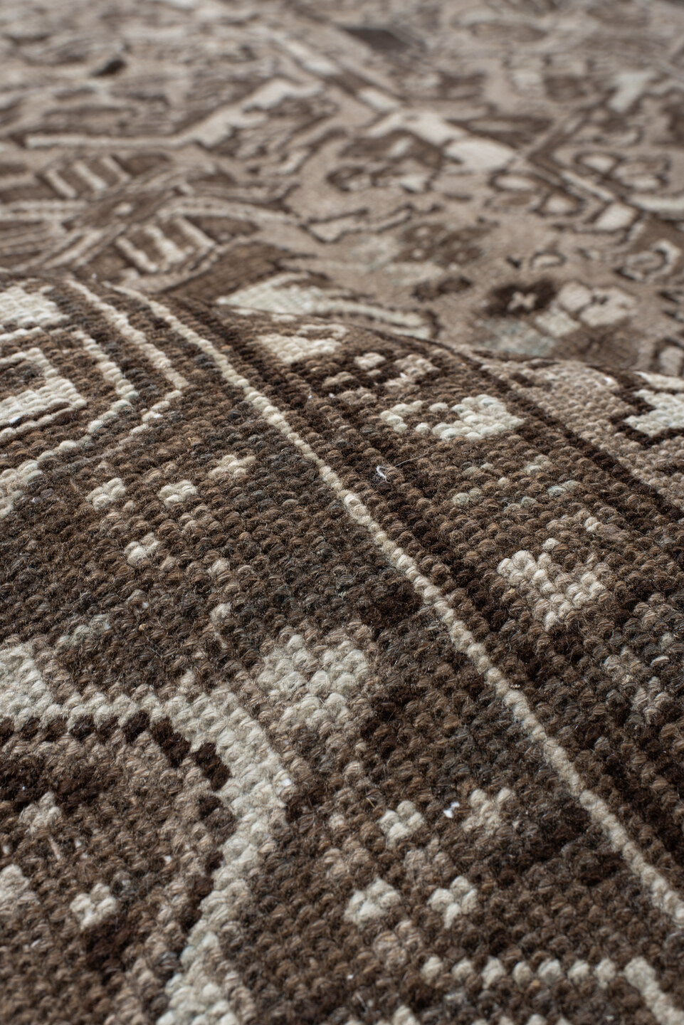 7' x 7' one-of-a-kind handmade antique Heriz rug. Color palette: taupe, brown, ivory, gray, charcoal, beige, black