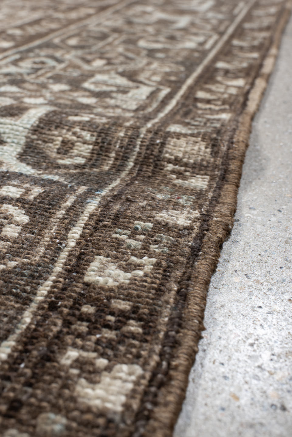 7' x 7' one-of-a-kind handmade antique Heriz rug. Color palette: taupe, brown, ivory, gray, charcoal, beige, black