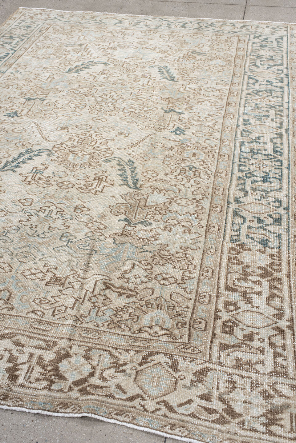 6' x 9' one-of-a-kind handmade antique Heriz medium size rug. Color palette: ivory, taupe, camel, sage, light blue, beige