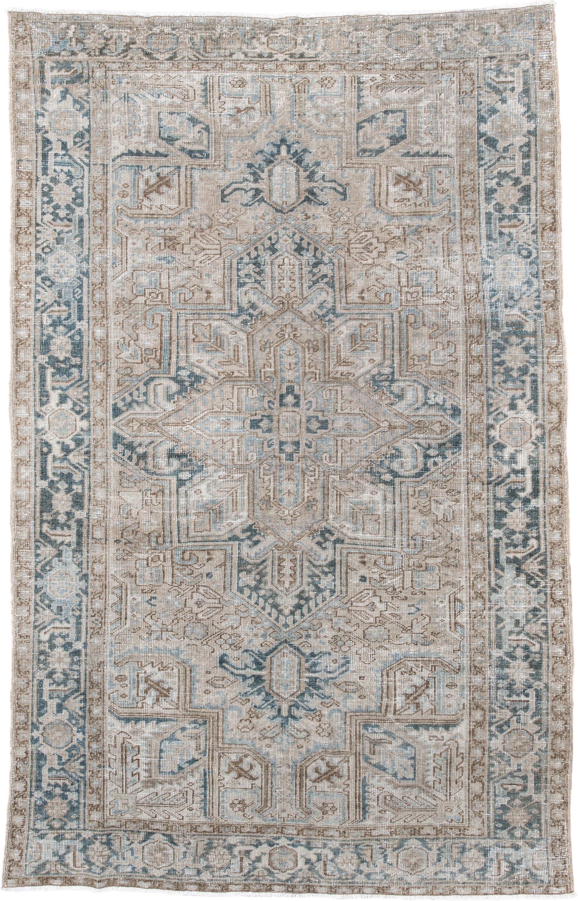 6' x 9' one-of-a-kind handmade antique Heriz medium size rug. Color palette: ivory, taupe, pale blue, beige, slate, cream