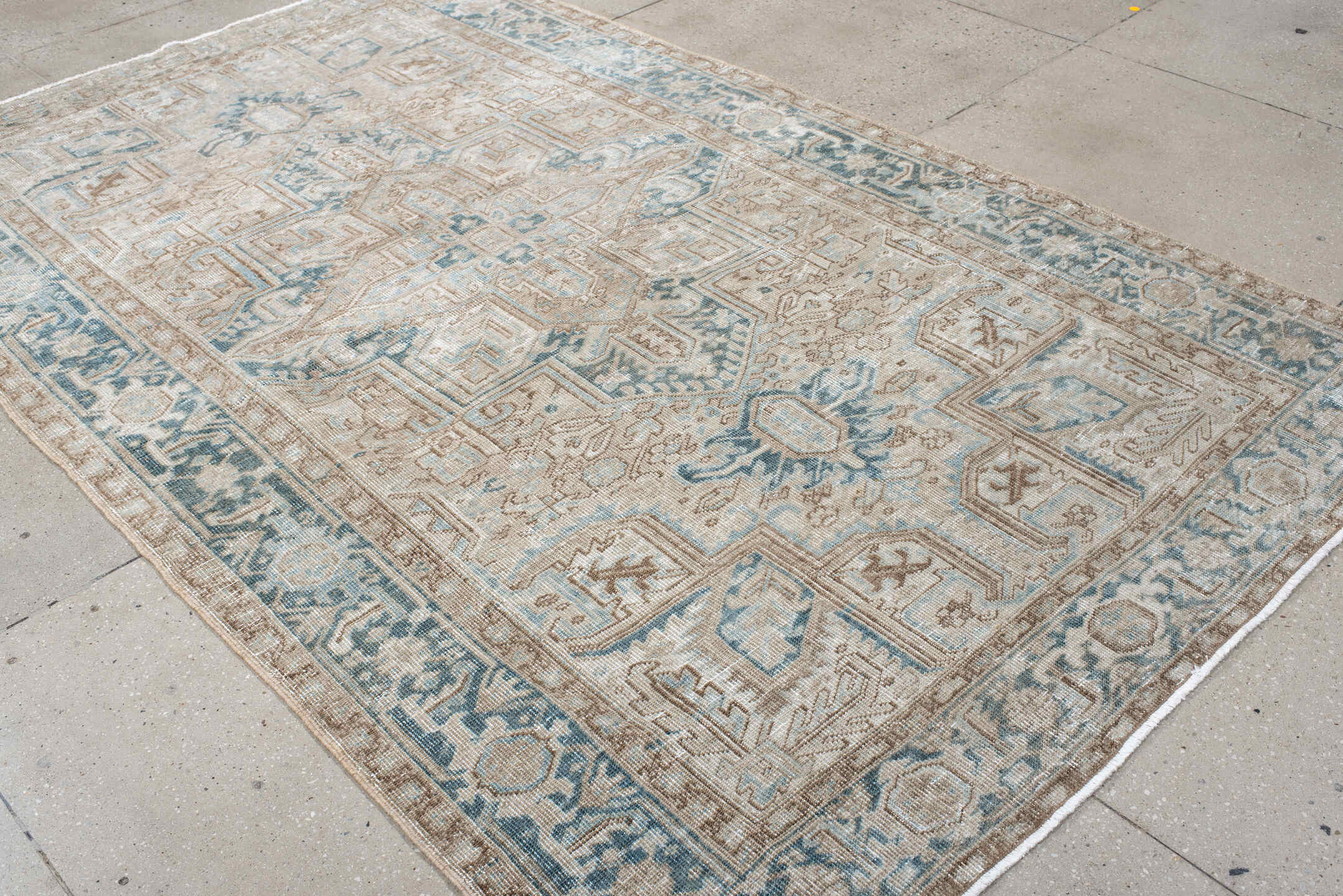 6' x 9' one-of-a-kind handmade antique Heriz medium size rug. Color palette: ivory, taupe, pale blue, beige, slate, cream