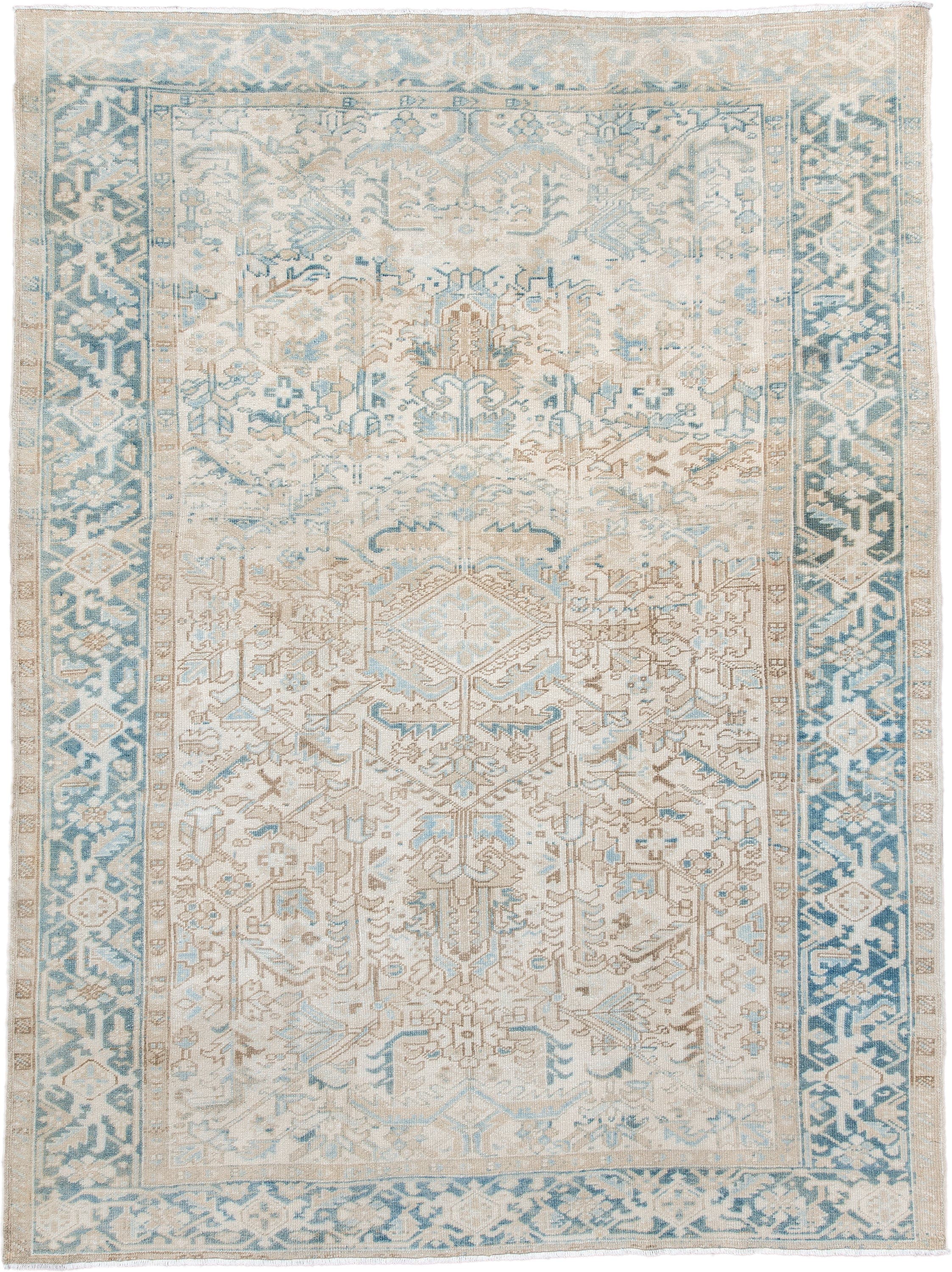7' x 9' one-of-a-kind handmade antique Heriz large size rug. Color palette: ivory, sky blue, beige, taupe, camel, light blue