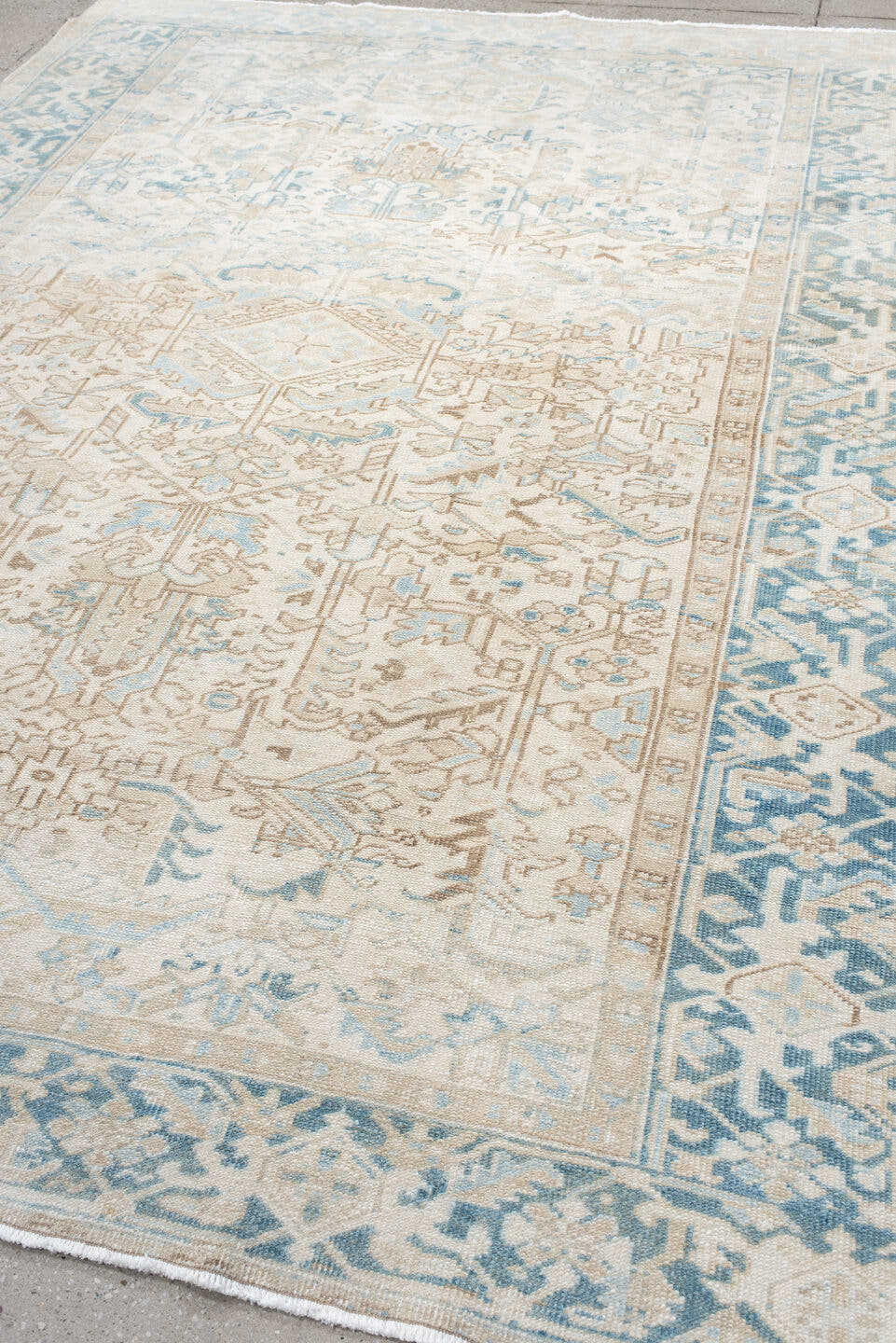 7' x 9' one-of-a-kind handmade antique Heriz large size rug. Color palette: ivory, sky blue, beige, taupe, camel, light blue
