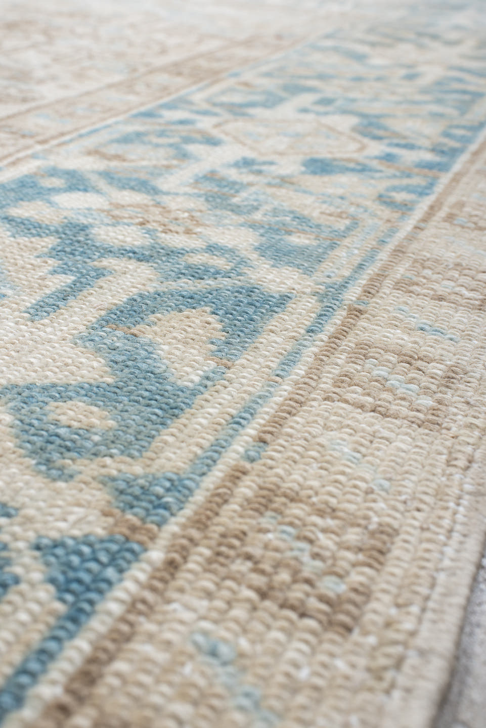 7' x 9' one-of-a-kind handmade antique Heriz large size rug. Color palette: ivory, sky blue, beige, taupe, camel, light blue