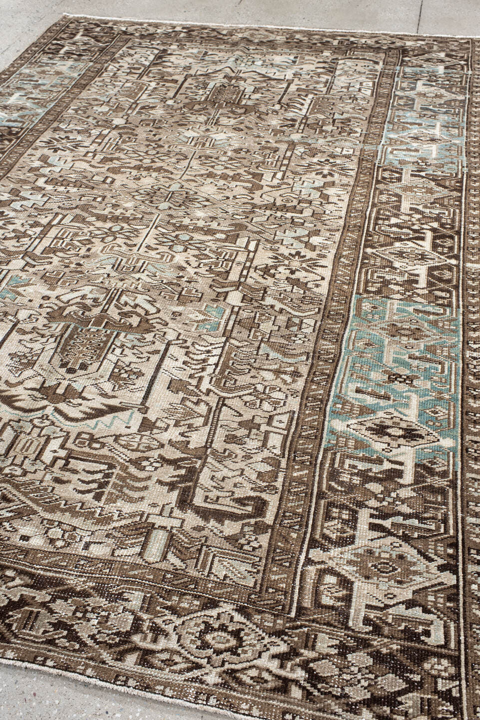 7' x 10' one-of-a-kind handmade antique Heriz large size rug. Color palette: ivory, brown, sky_blue, taupe, charcoal
