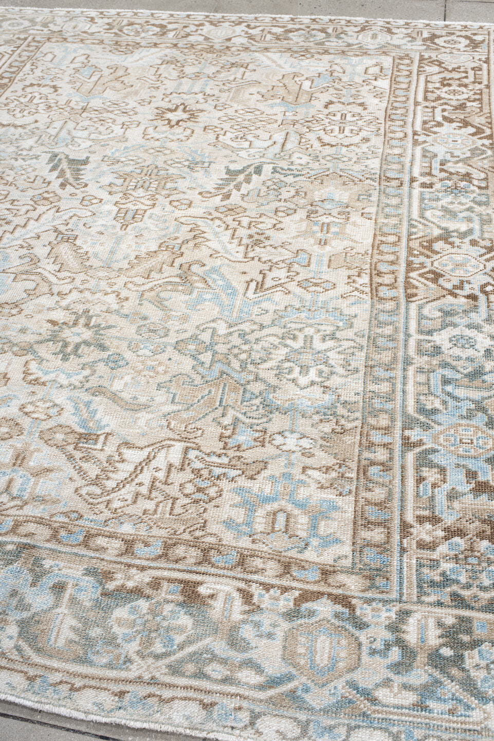 7' x 8' one-of-a-kind handmade antique Heriz rug. Color palette: ivory, camel, pale blue, taupe, light gray, sand, beige
