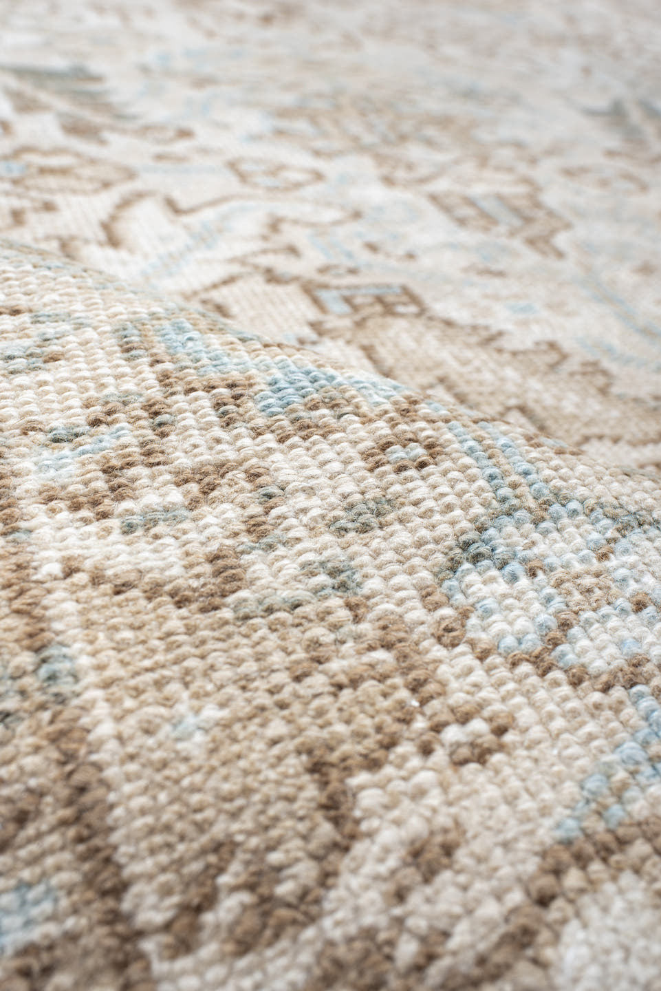 7' x 8' one-of-a-kind handmade antique Heriz rug. Color palette: ivory, camel, pale blue, taupe, light gray, sand, beige