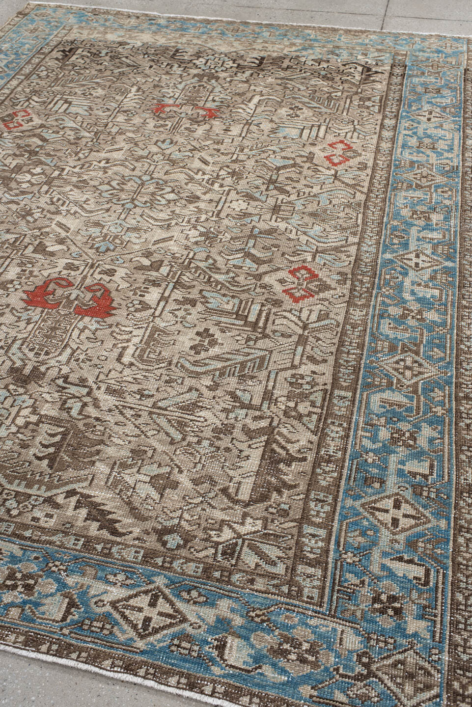 6' x 9' one-of-a-kind handmade antique Heriz medium size rug. Color palette: ivory, sky_blue, taupe, brown, rust, camel