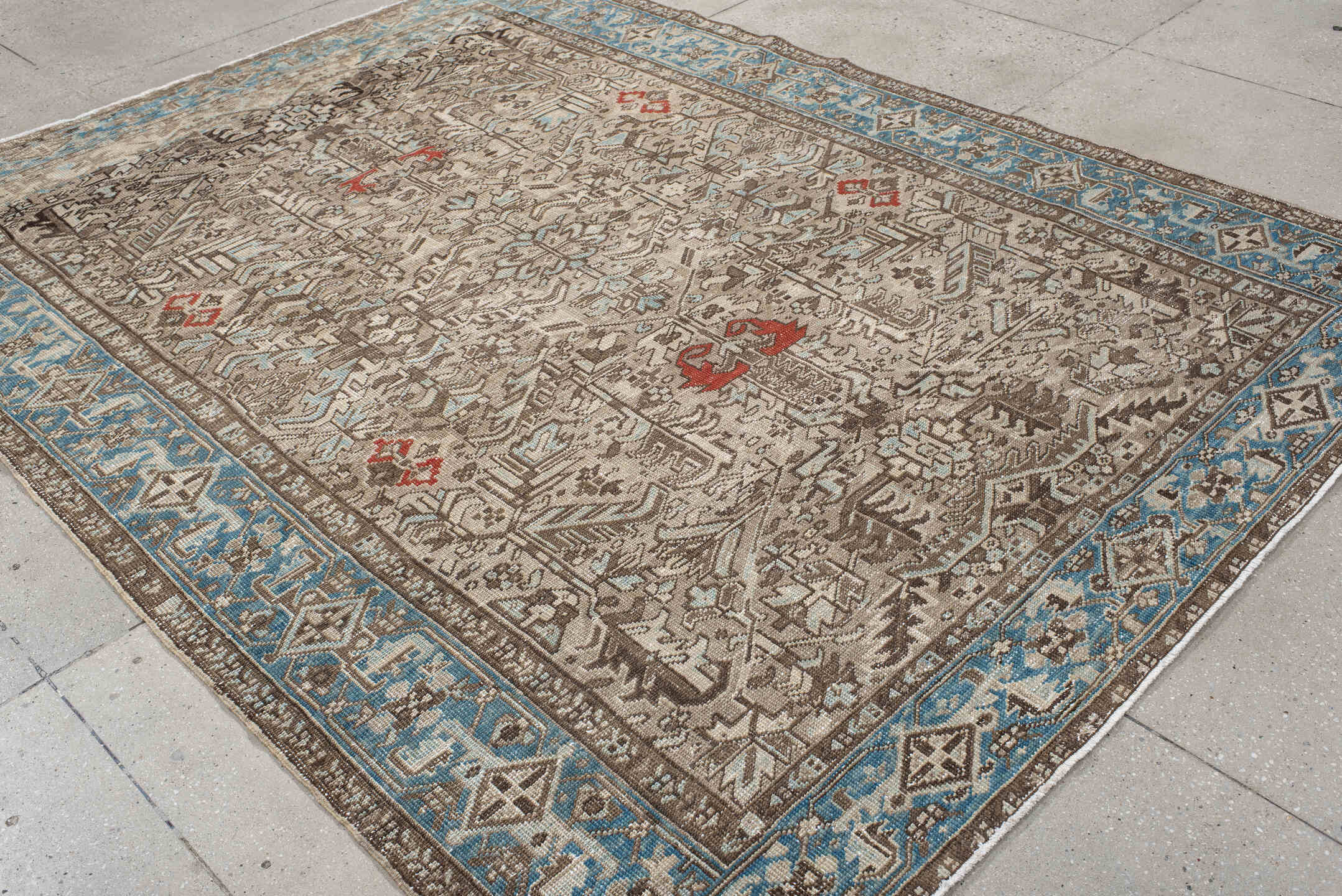 6' x 9' one-of-a-kind handmade antique Heriz medium size rug. Color palette: ivory, sky_blue, taupe, brown, rust, camel
