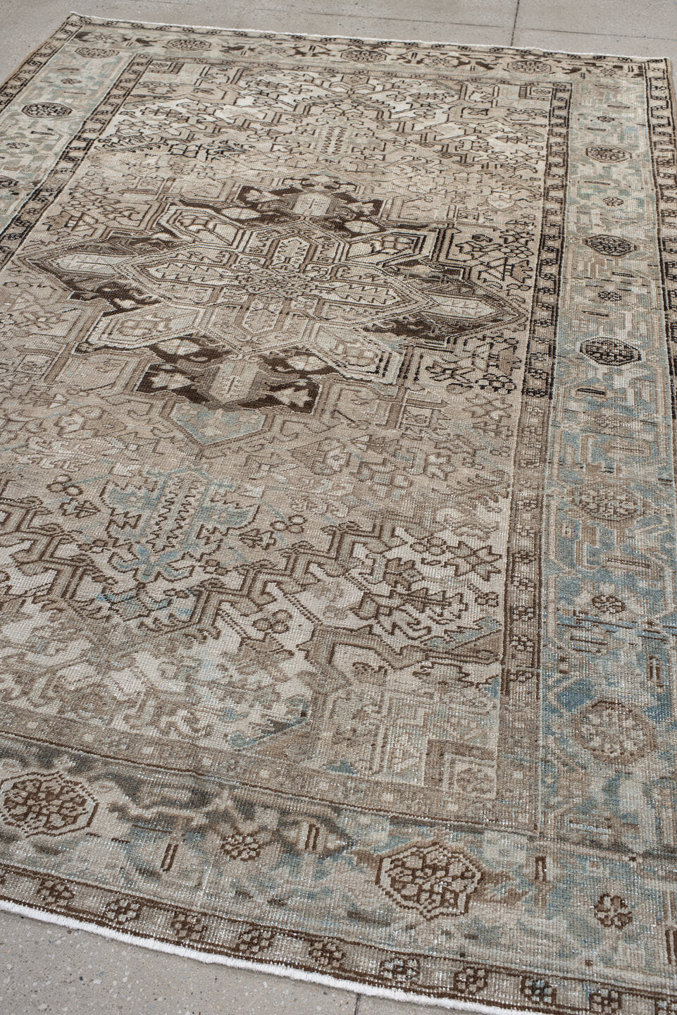 6' x 9' one-of-a-kind handmade vintage Heriz medium size rug. Color palette: taupe, ivory, light blue, charcoal, brown