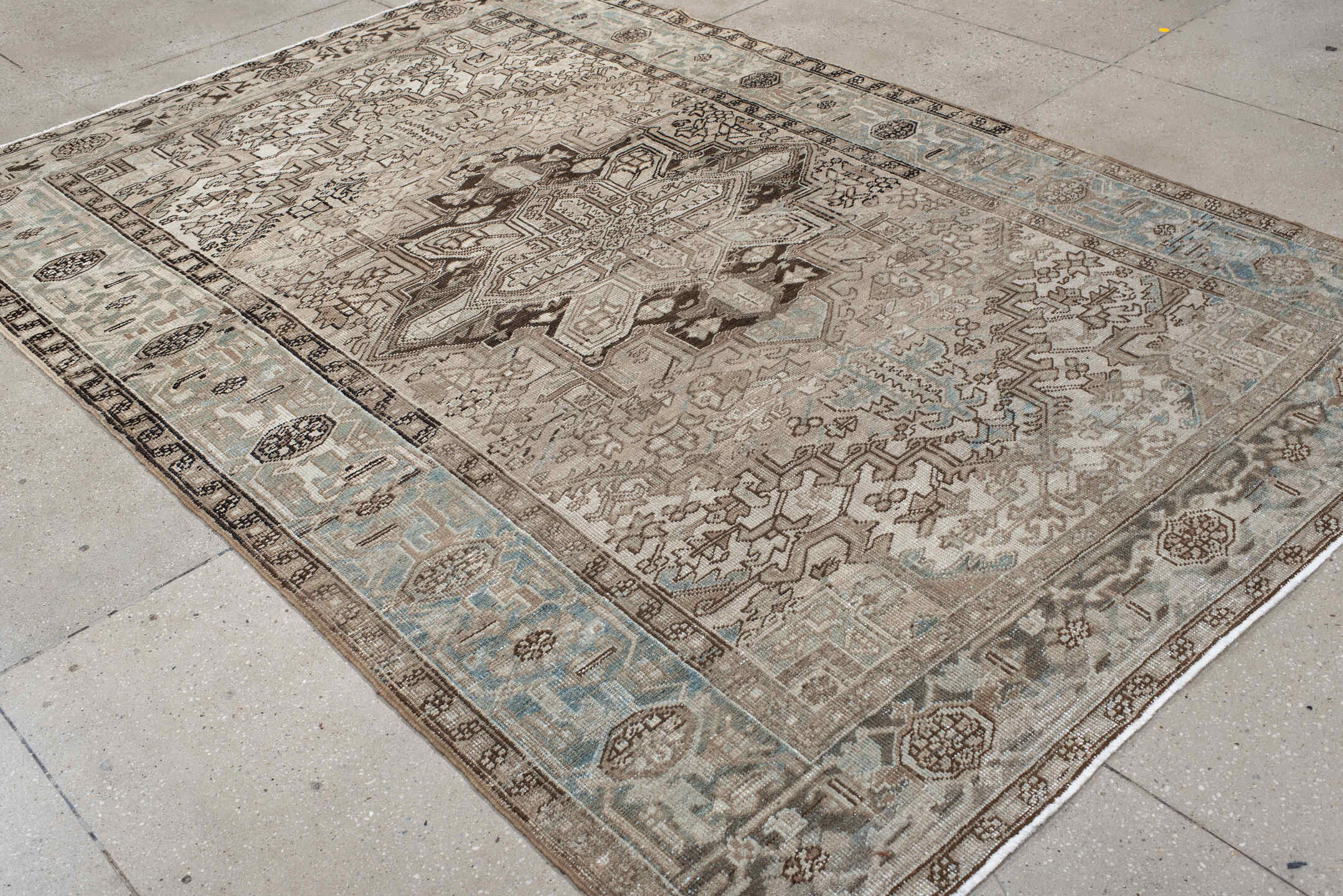 6' x 9' one-of-a-kind handmade vintage Heriz medium size rug. Color palette: taupe, ivory, light blue, charcoal, brown
