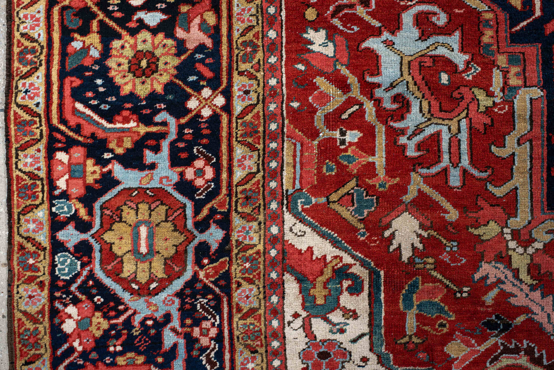 9' x 12' one-of-a-kind handmade antique Heriz large size rug. Color palette: rust, navy, ivory, sky blue, soft gold, coral