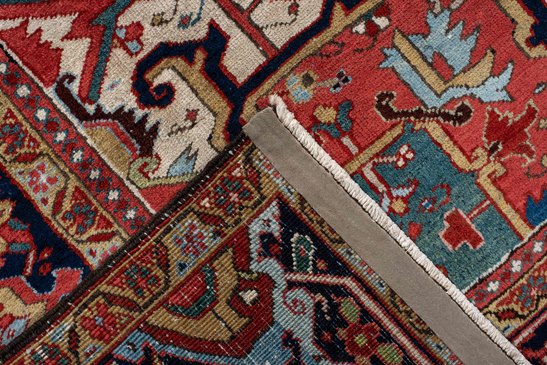 9' x 12' one-of-a-kind handmade antique Heriz large size rug. Color palette: rust, navy, ivory, sky blue, soft gold, coral