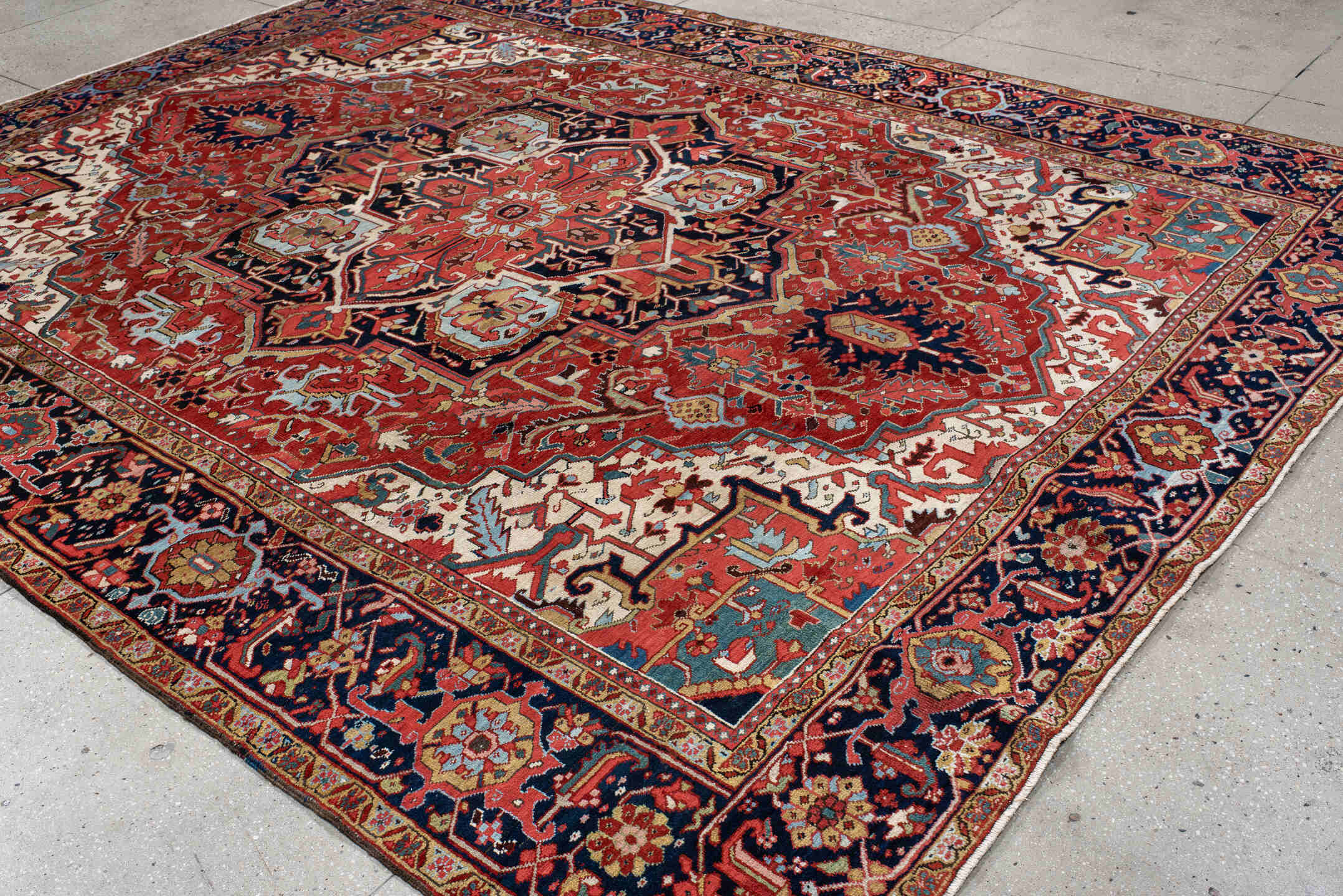 9' x 12' one-of-a-kind handmade antique Heriz large size rug. Color palette: rust, navy, ivory, sky blue, soft gold, coral