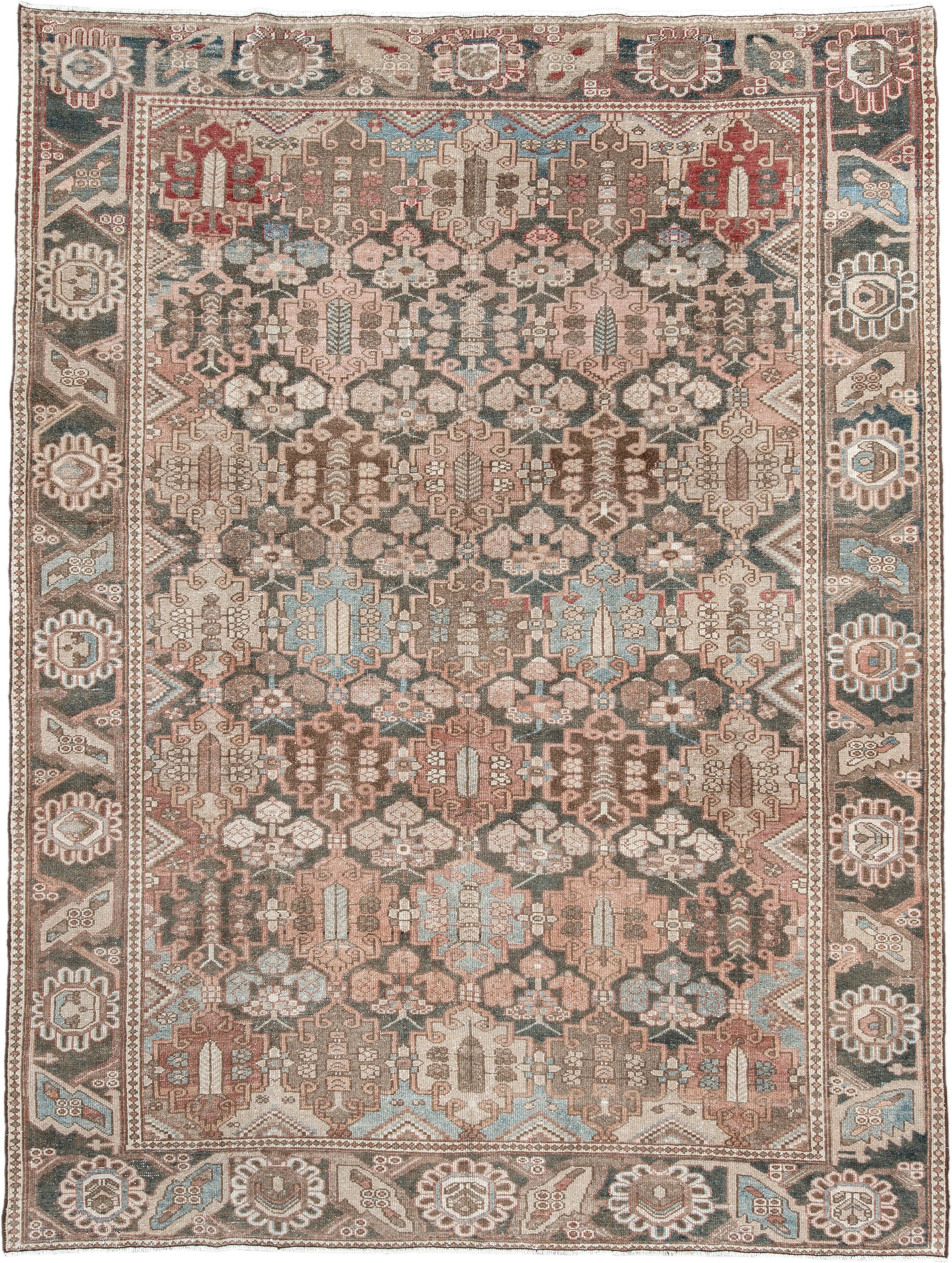 7' x 9' one-of-a-kind handmade vintage Baktiary rug. Color palette: taupe, charcoal, blush, ivory, sky blue, brown, rose