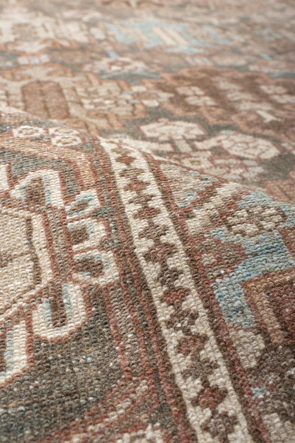 7' x 9' one-of-a-kind handmade vintage Baktiary rug. Color palette: taupe, charcoal, blush, ivory, sky blue, brown, rose