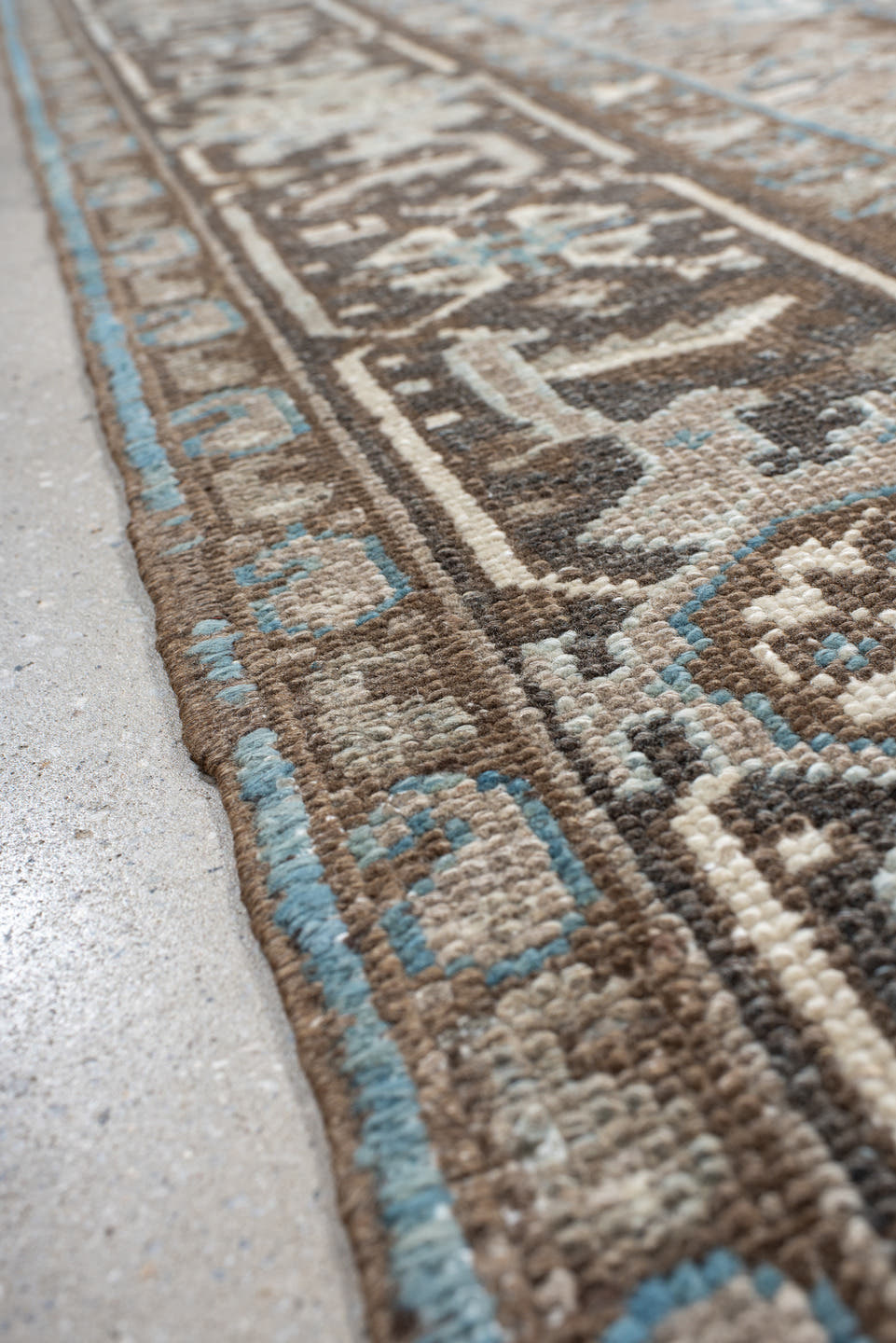 6' x 7' one-of-a-kind handmade antique Heriz rug. Color palette: taupe, brown, ivory, sky blue, charcoal, camel, beige, gray