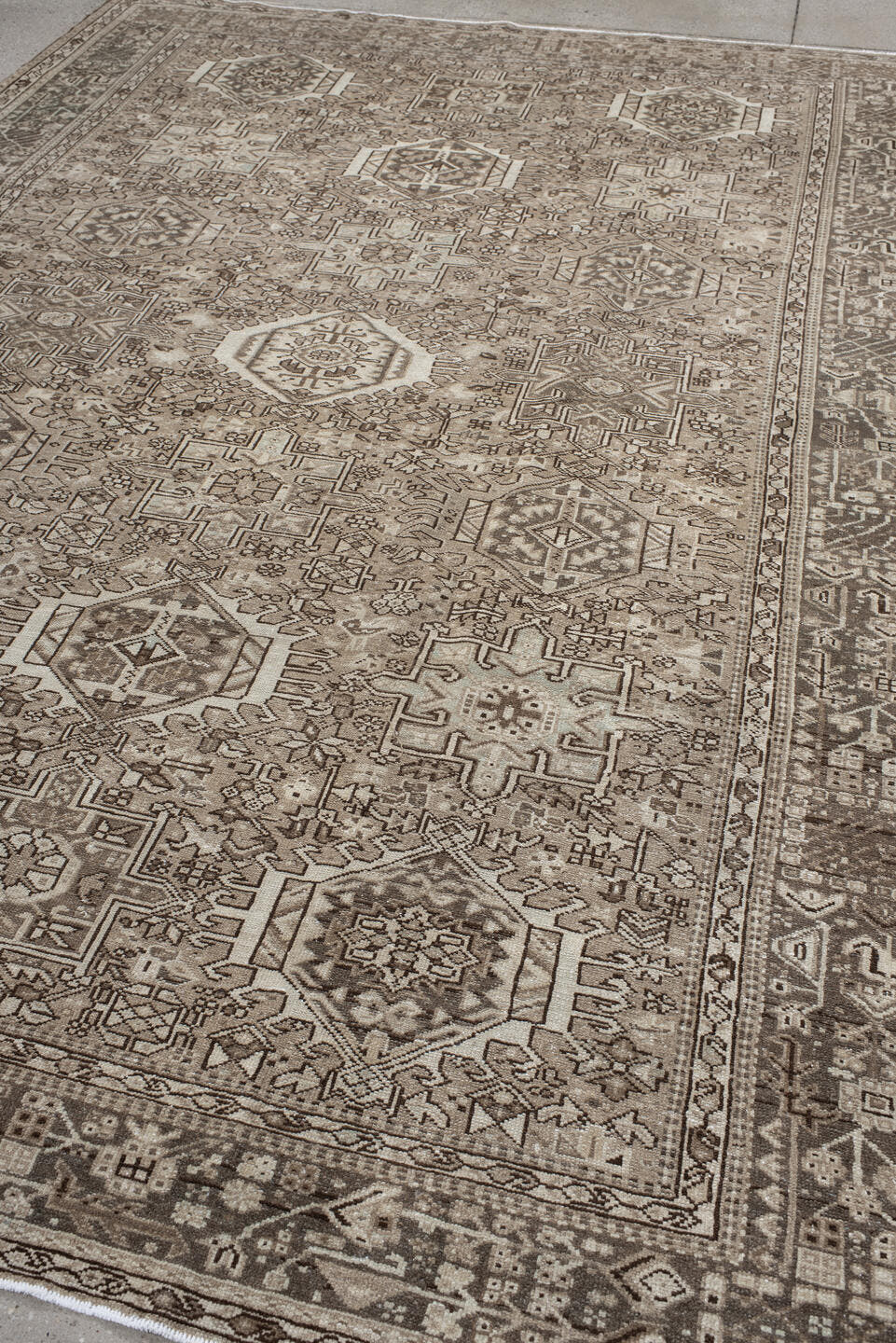 7' x 10' one-of-a-kind handmade vintage Karaje large size rug. Color palette: taupe, ivory, brown, rose, camel, charcoal