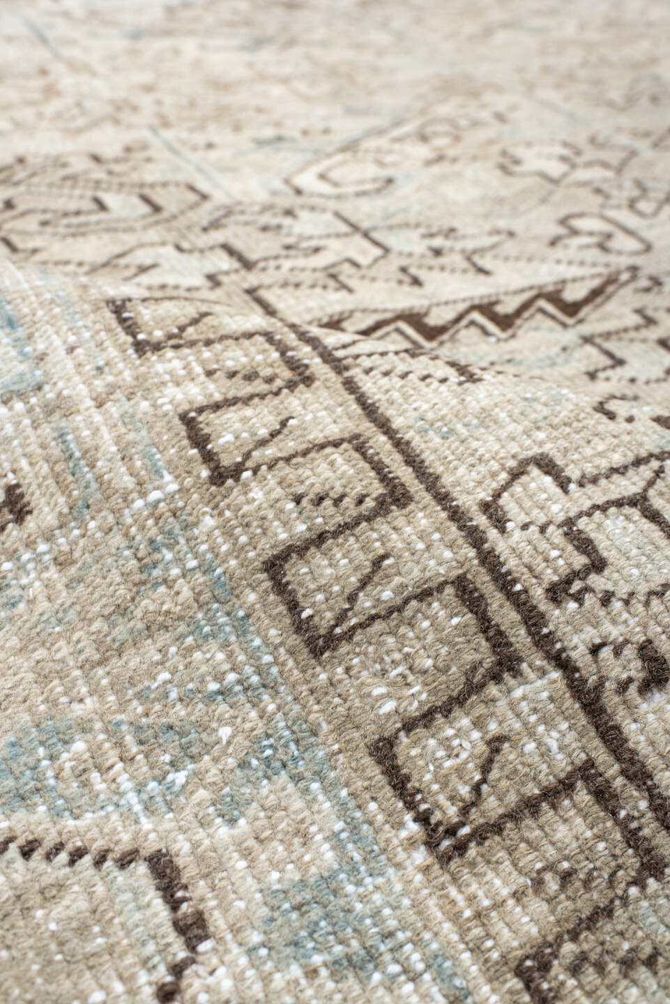7' x 8' one-of-a-kind handmade antique Heriz rug. Color palette: ivory, pale blue, taupe, brown, cream, light blue, beige