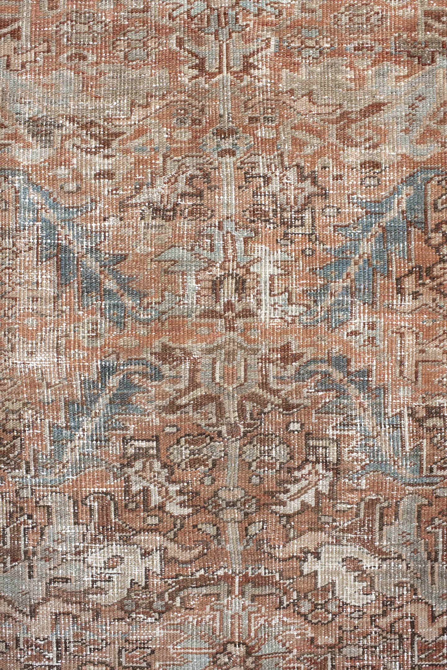6' x 8' one-of-a-kind handmade antique Heriz medium size rug. Color palette: terra cotta, ivory, soft blue, taupe, rust