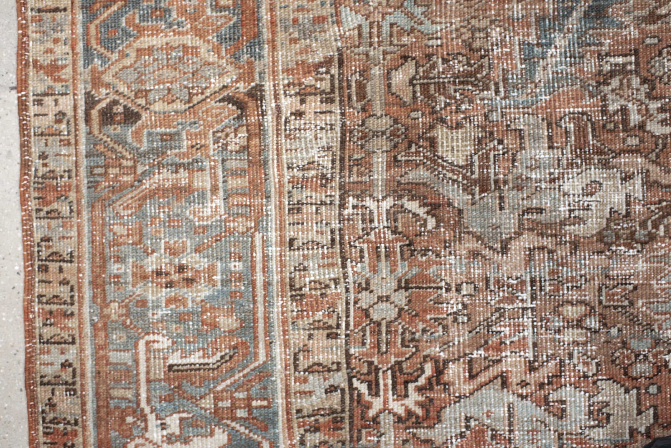 6' x 8' one-of-a-kind handmade antique Heriz medium size rug. Color palette: terra cotta, ivory, soft blue, taupe, rust