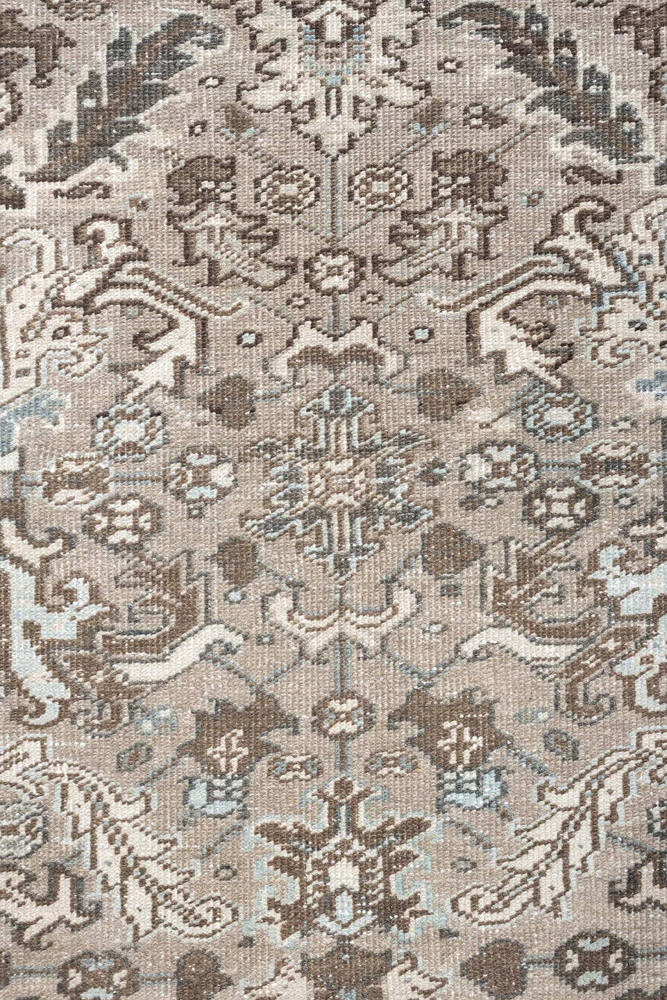 7' x 9' one-of-a-kind handmade vintage Heriz rug. Color palette: taupe, brown, ivory, pale blue, camel, charcoal, beige