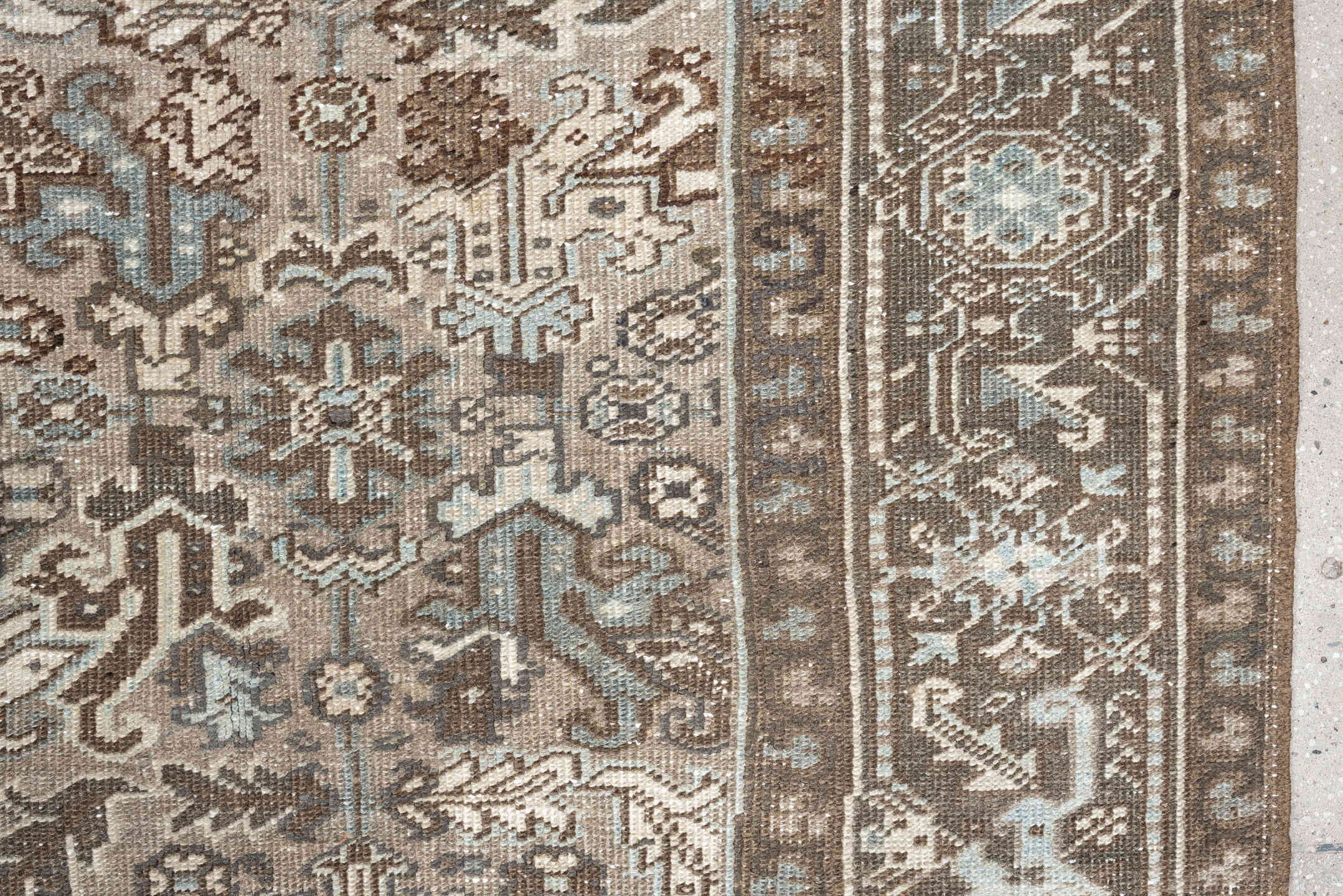 7' x 9' one-of-a-kind handmade vintage Heriz rug. Color palette: taupe, brown, ivory, pale blue, camel, charcoal, beige
