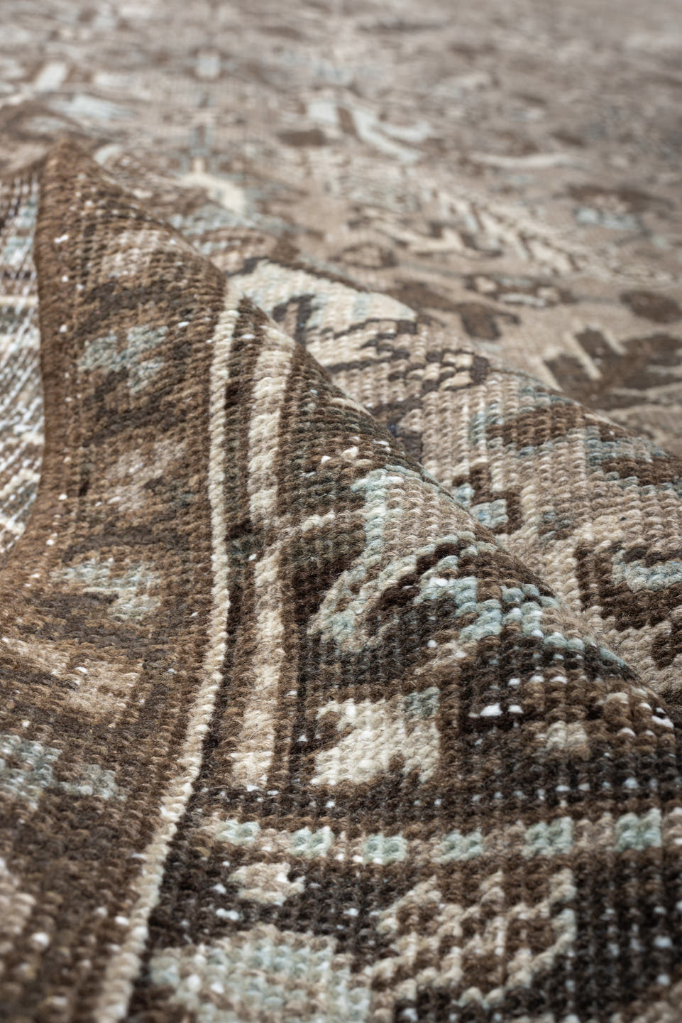 7' x 9' one-of-a-kind handmade vintage Heriz rug. Color palette: taupe, brown, ivory, pale blue, camel, charcoal, beige
